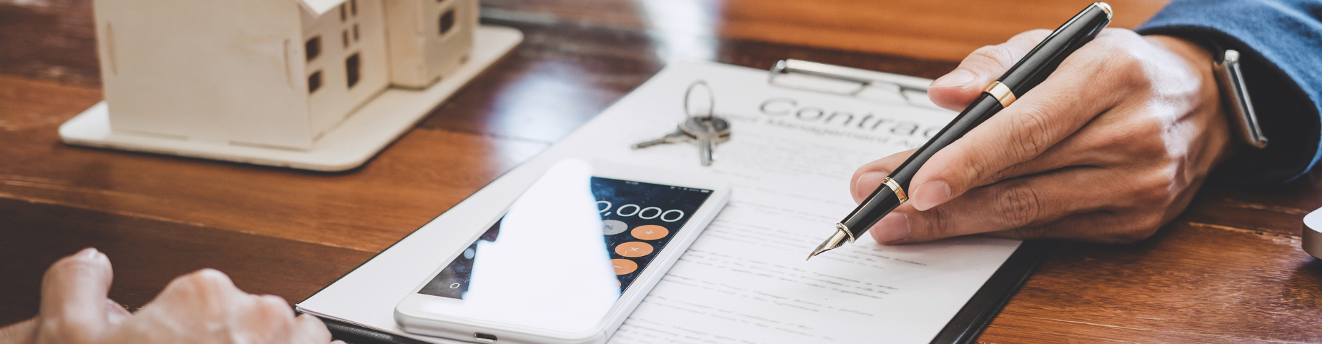 A person writing on a piece of paper.