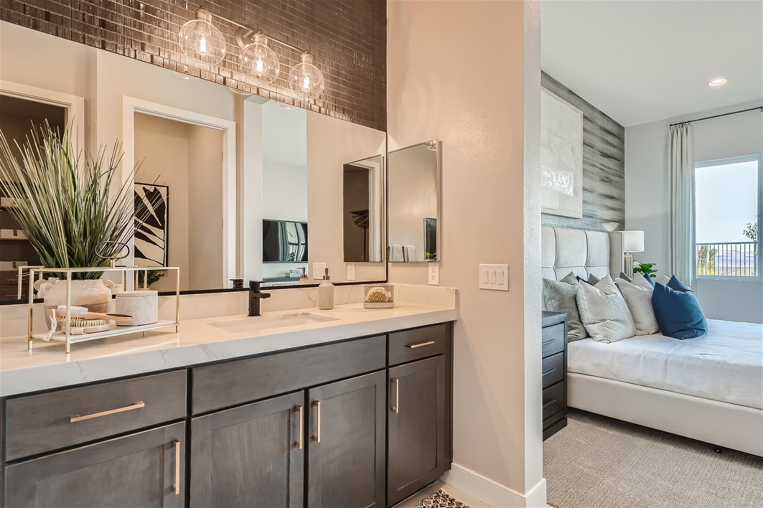 A bathroom with a bed and a couch.