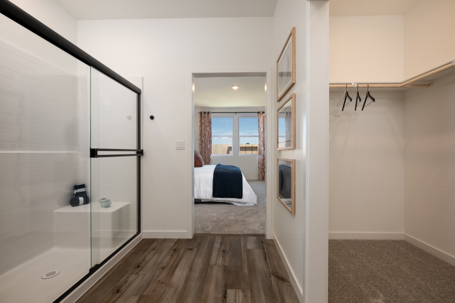 A bedroom with a glass door.