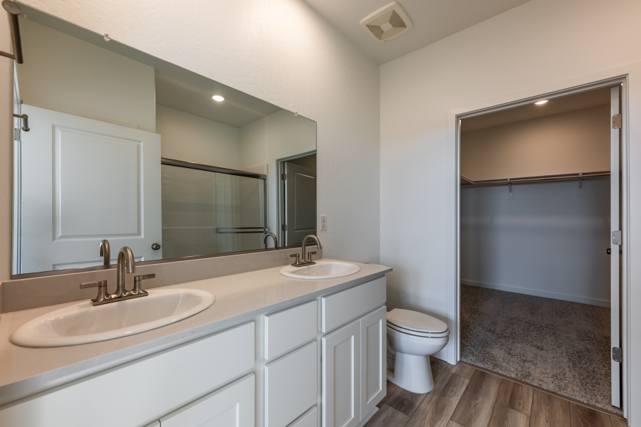 A bathroom with a sink toilet and shower.
