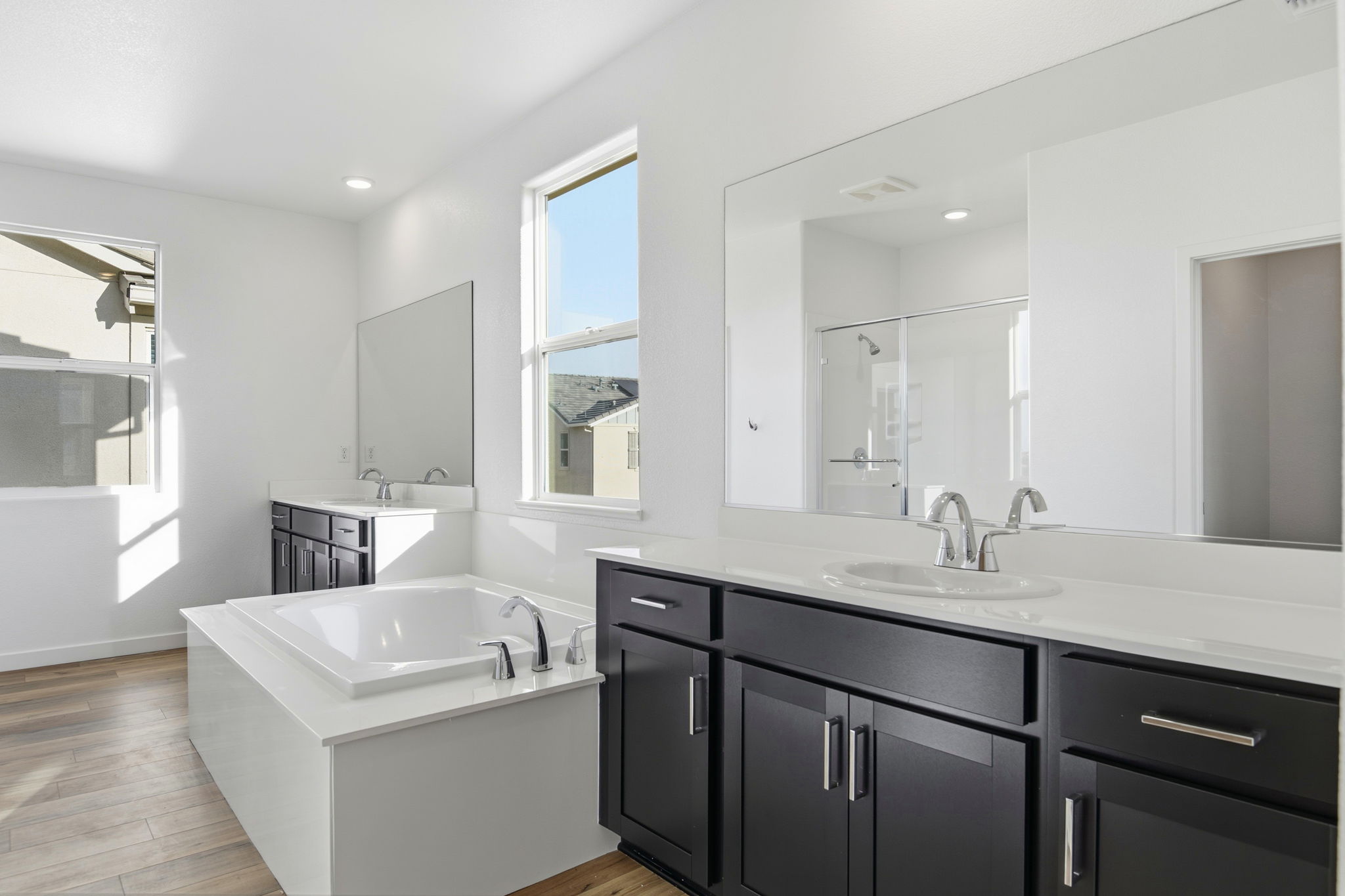 A bathroom with a large mirror.