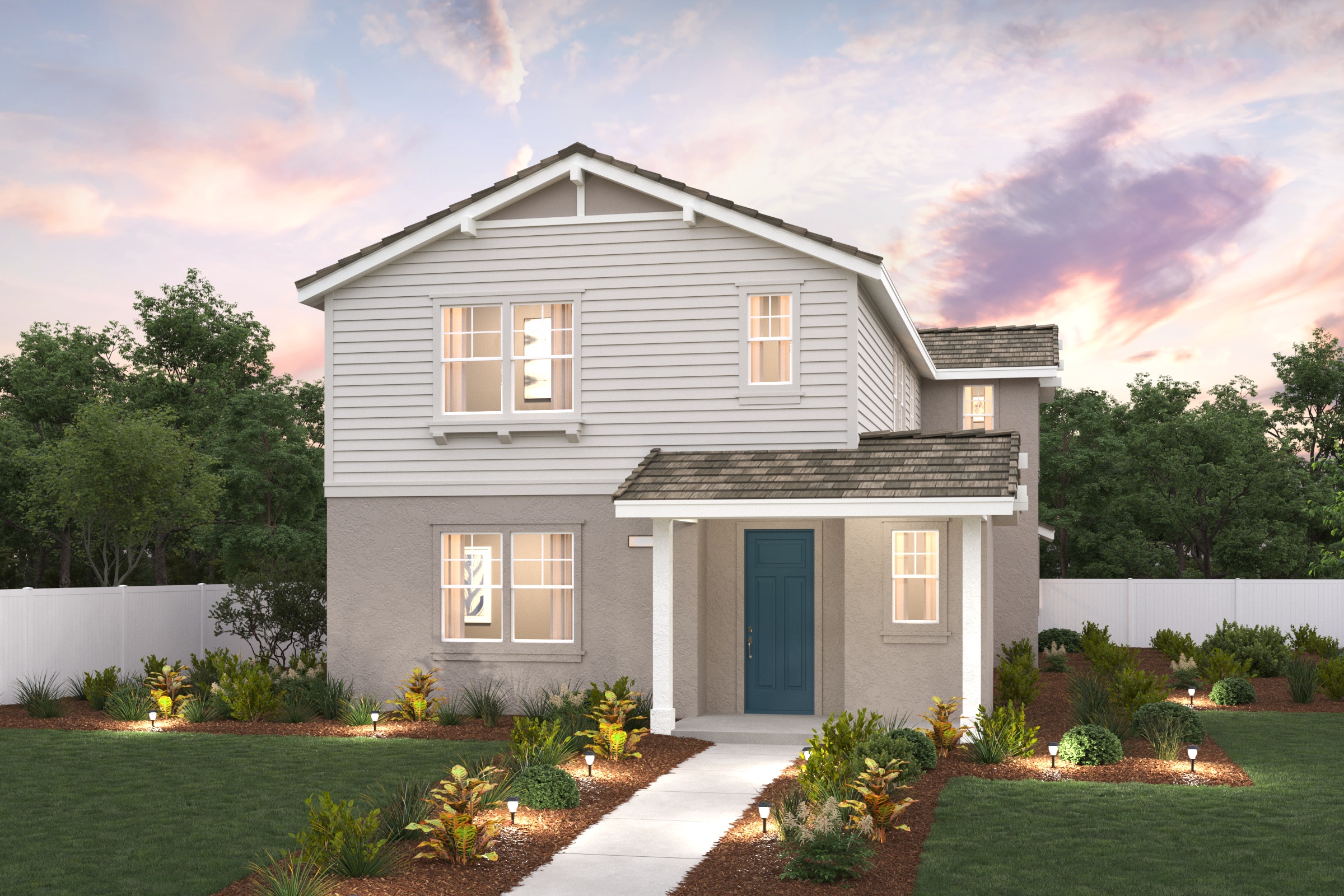 A house with a driveway and a fence and trees in the background.
