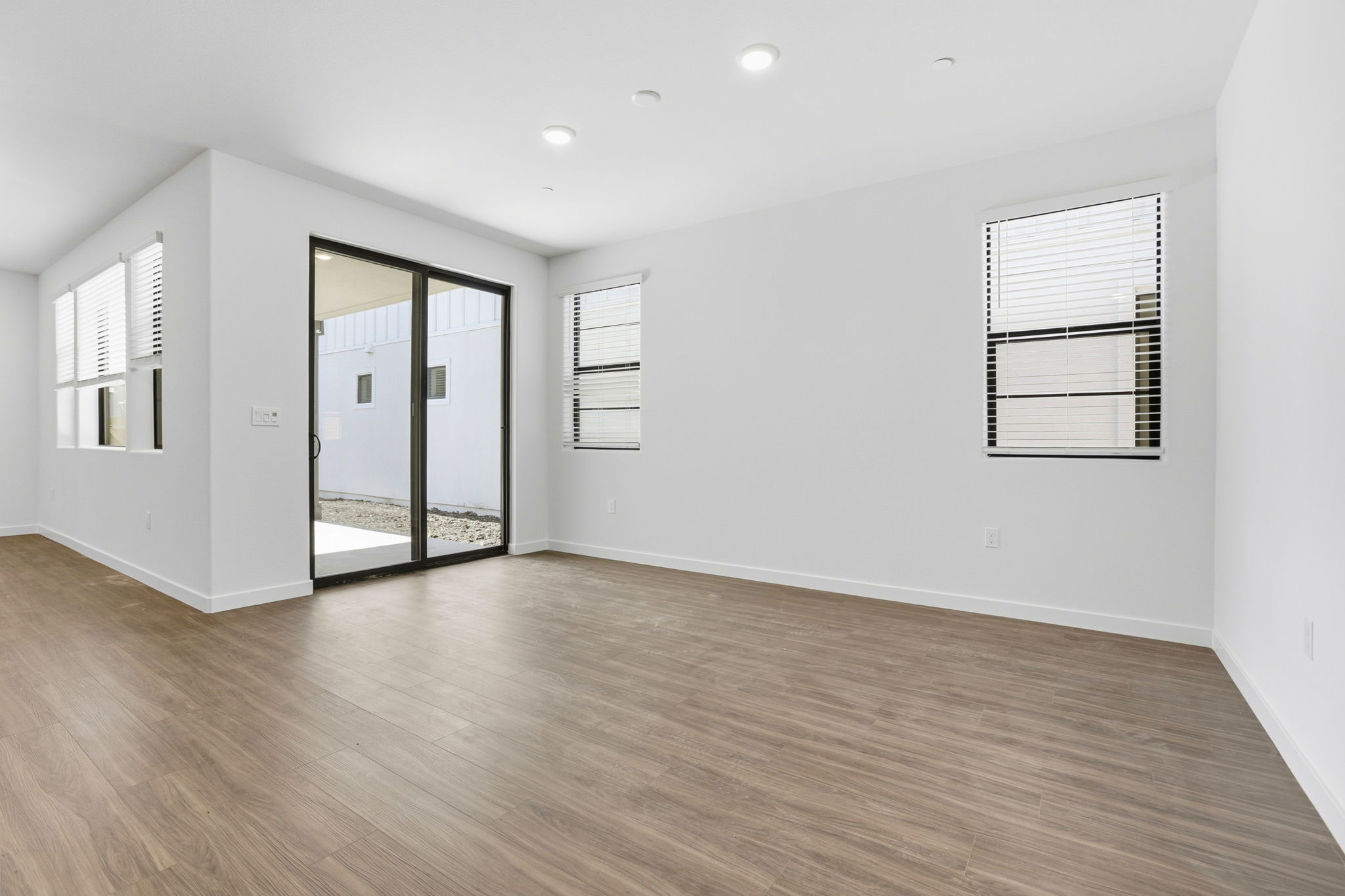 A room with a wood floor and a wood floor.