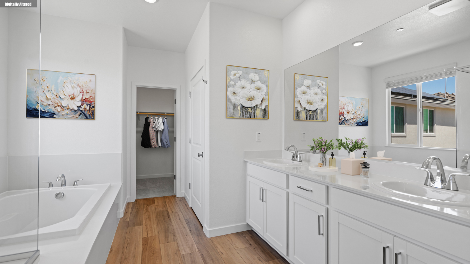 A bathroom with a tub sink and a mirror.