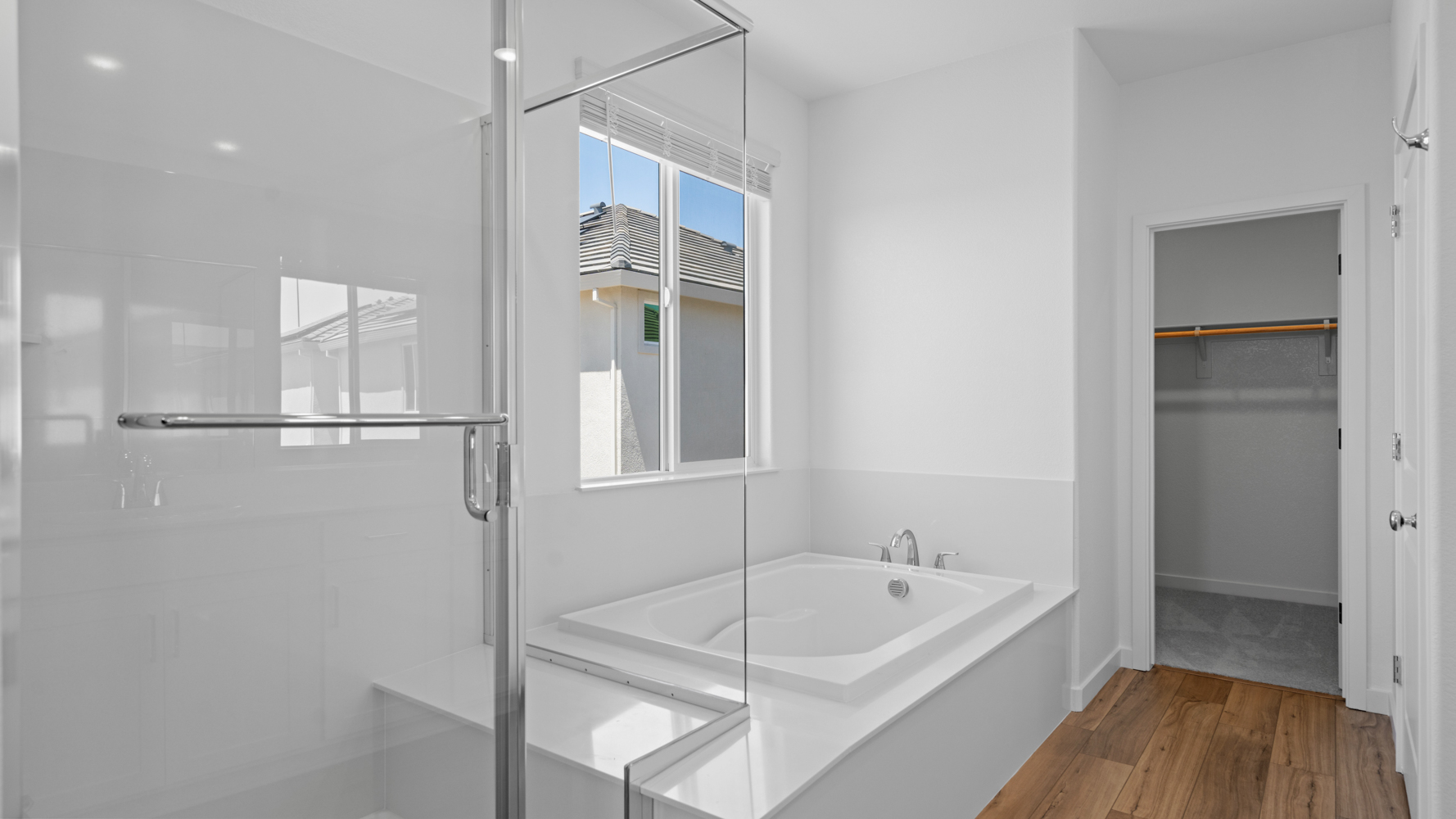 A bathroom with a tub and shower.