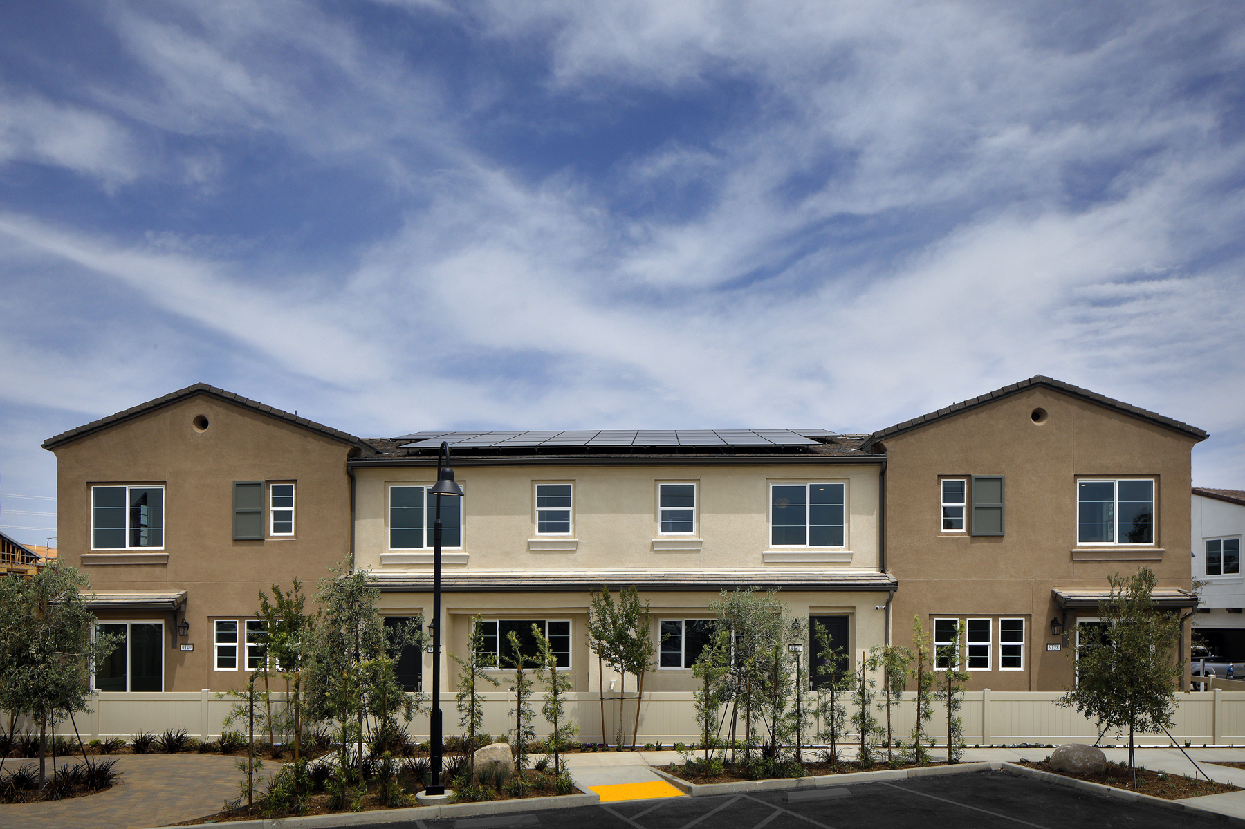 A building with trees in front.