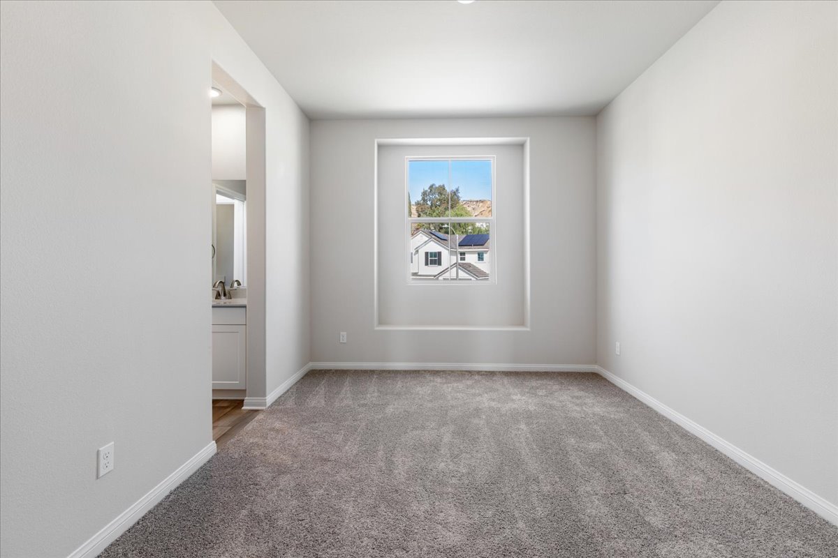 A hallway with a painting on the wall.