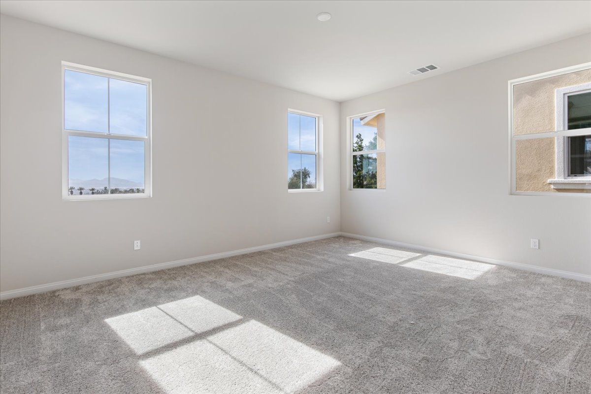A room with windows and a tile floor.