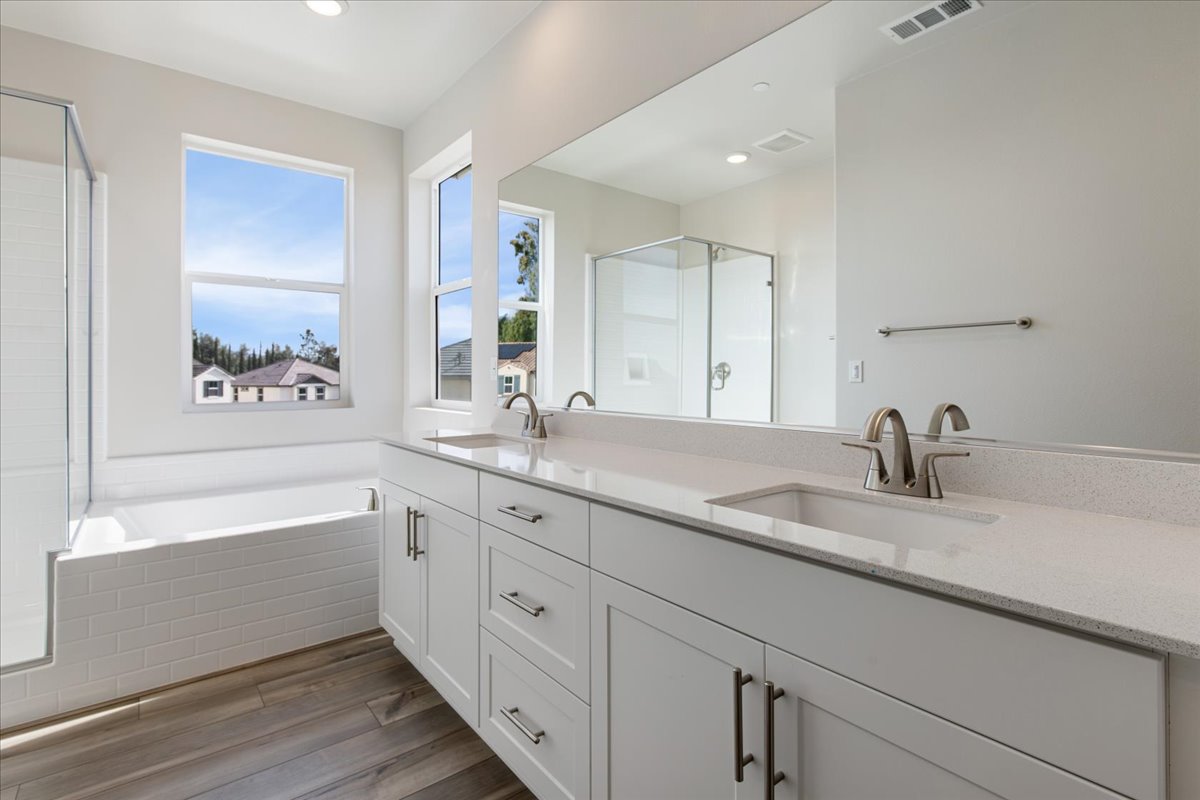 A bathroom with a large mirror.