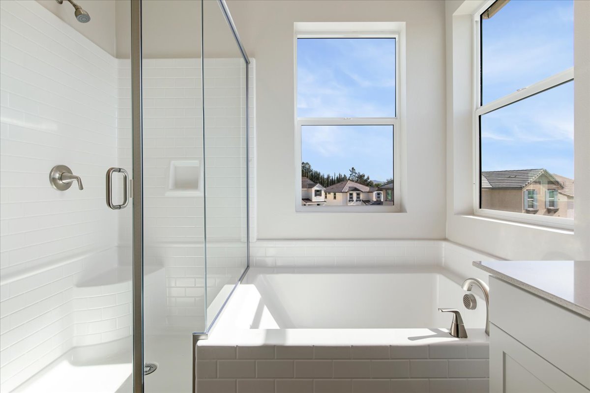 A bathroom with a glass shower.