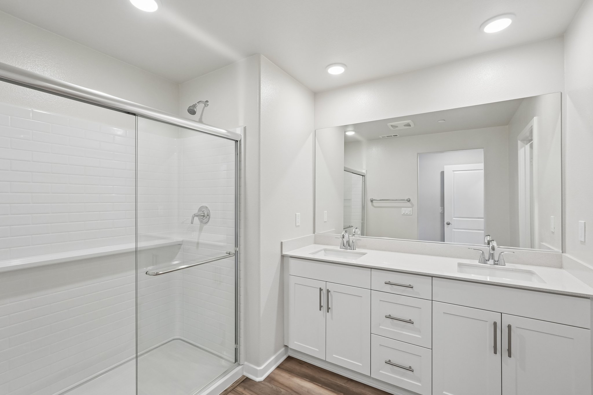 A bathroom with a glass shower.