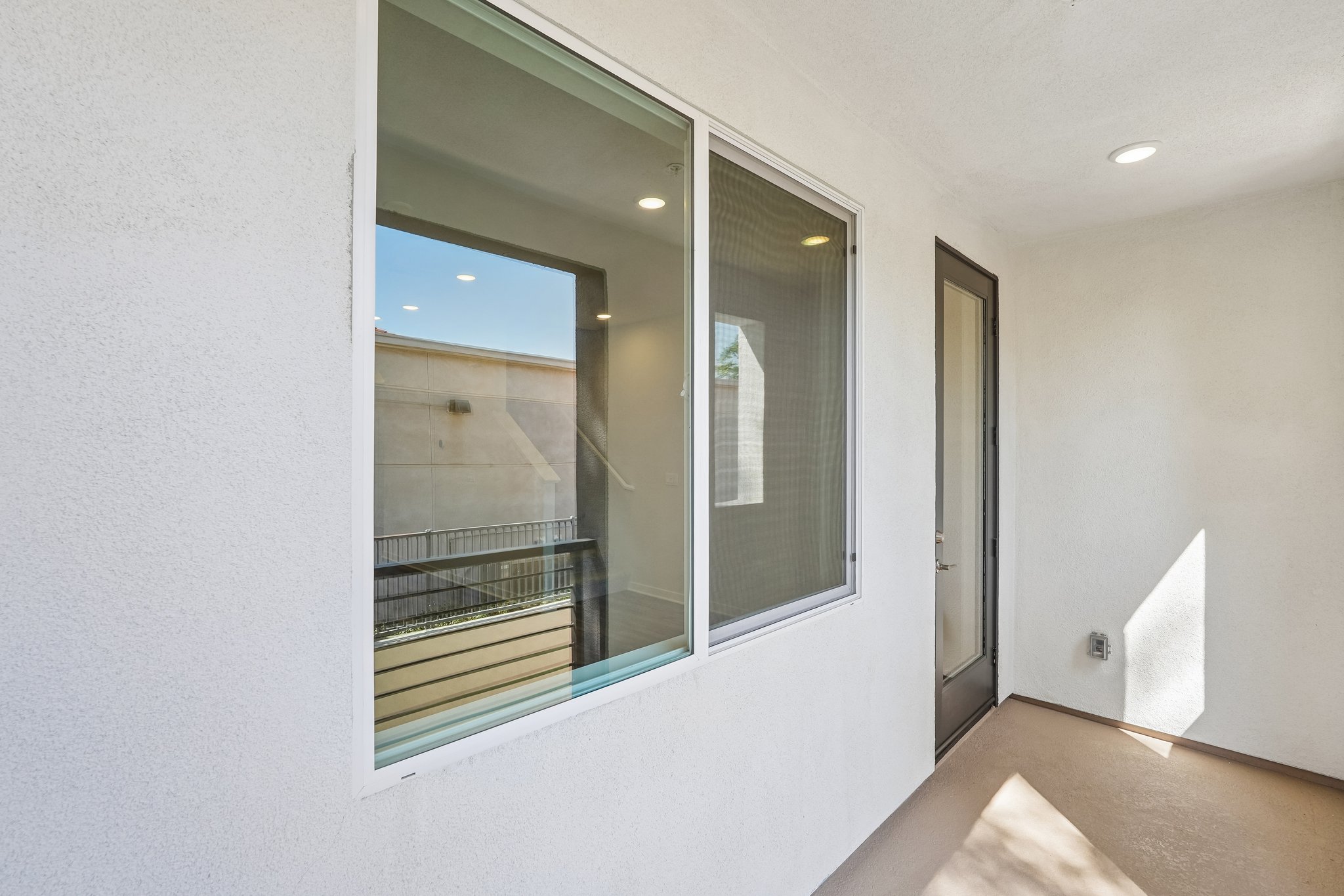 A room with a glass door.
