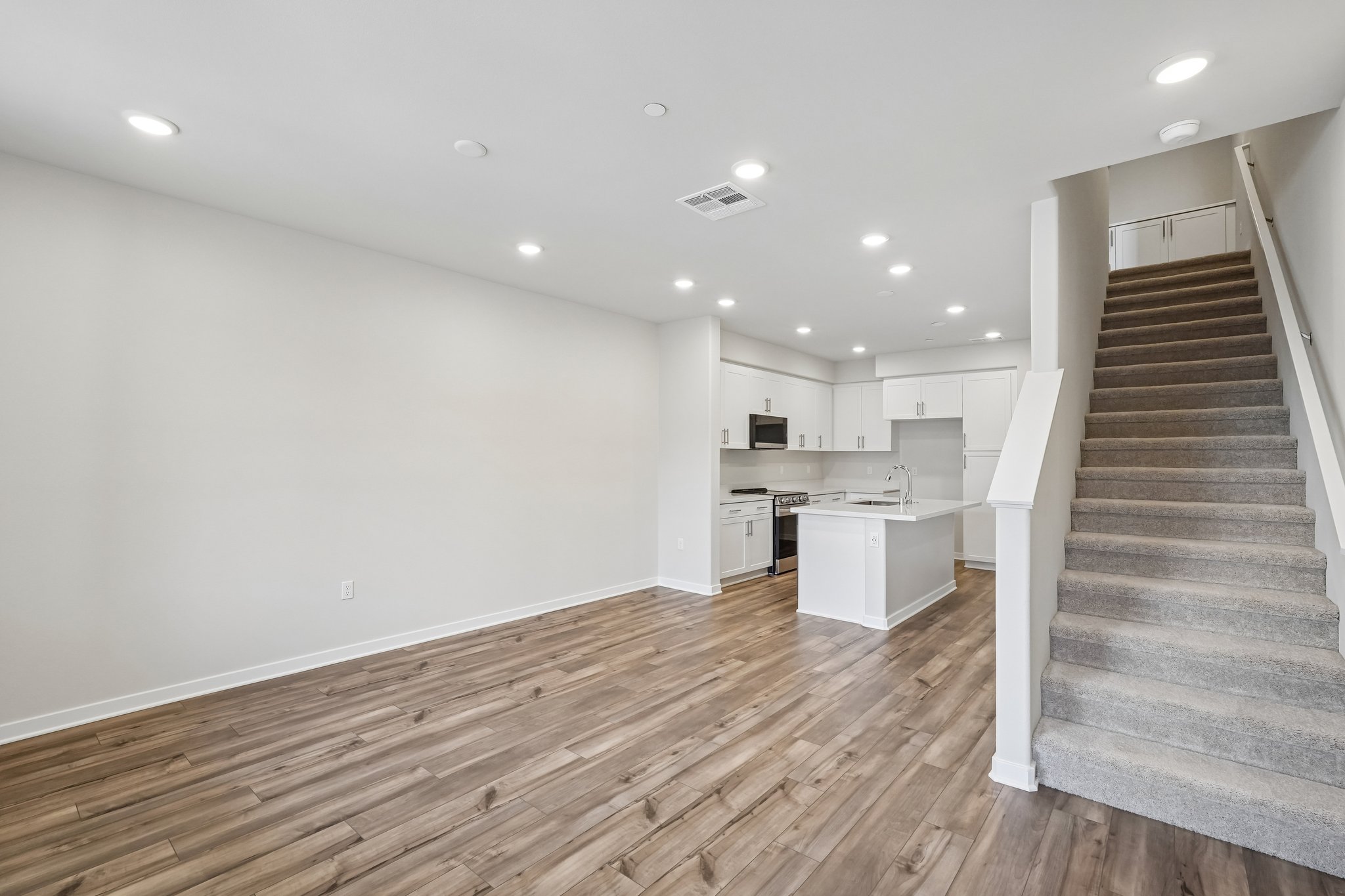 A kitchen with wooden floors.