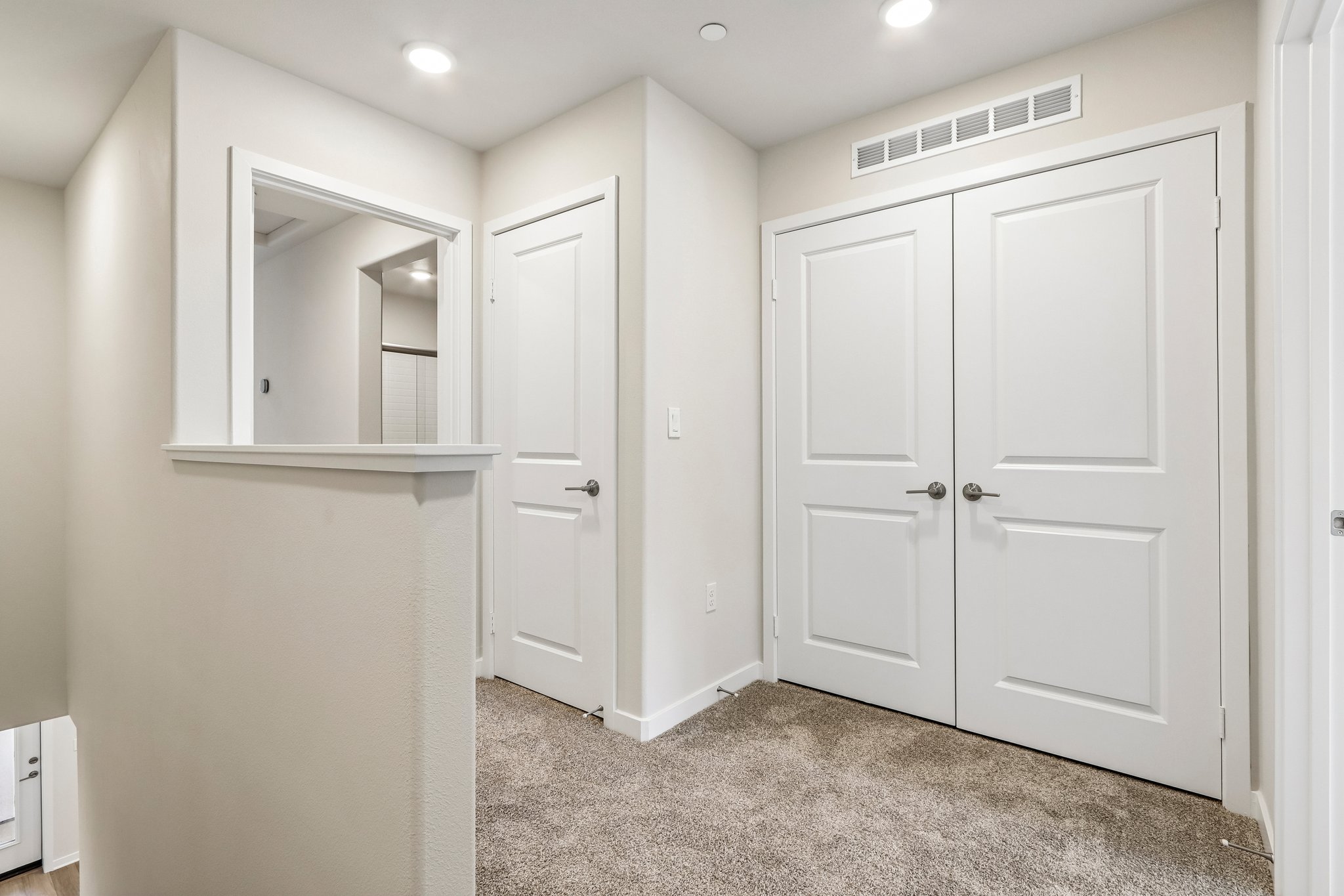 A room with white cabinets.