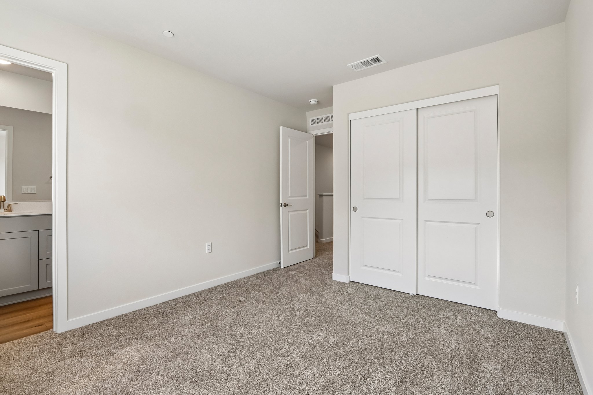 A room with white doors.