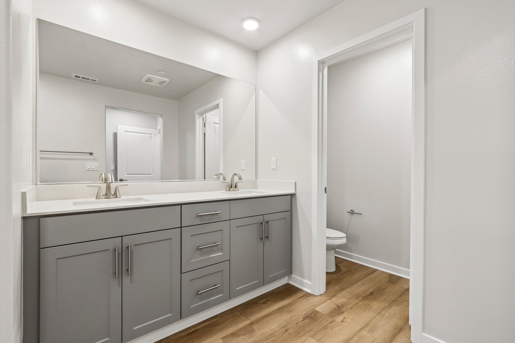 A bathroom with a sink and a toilet.