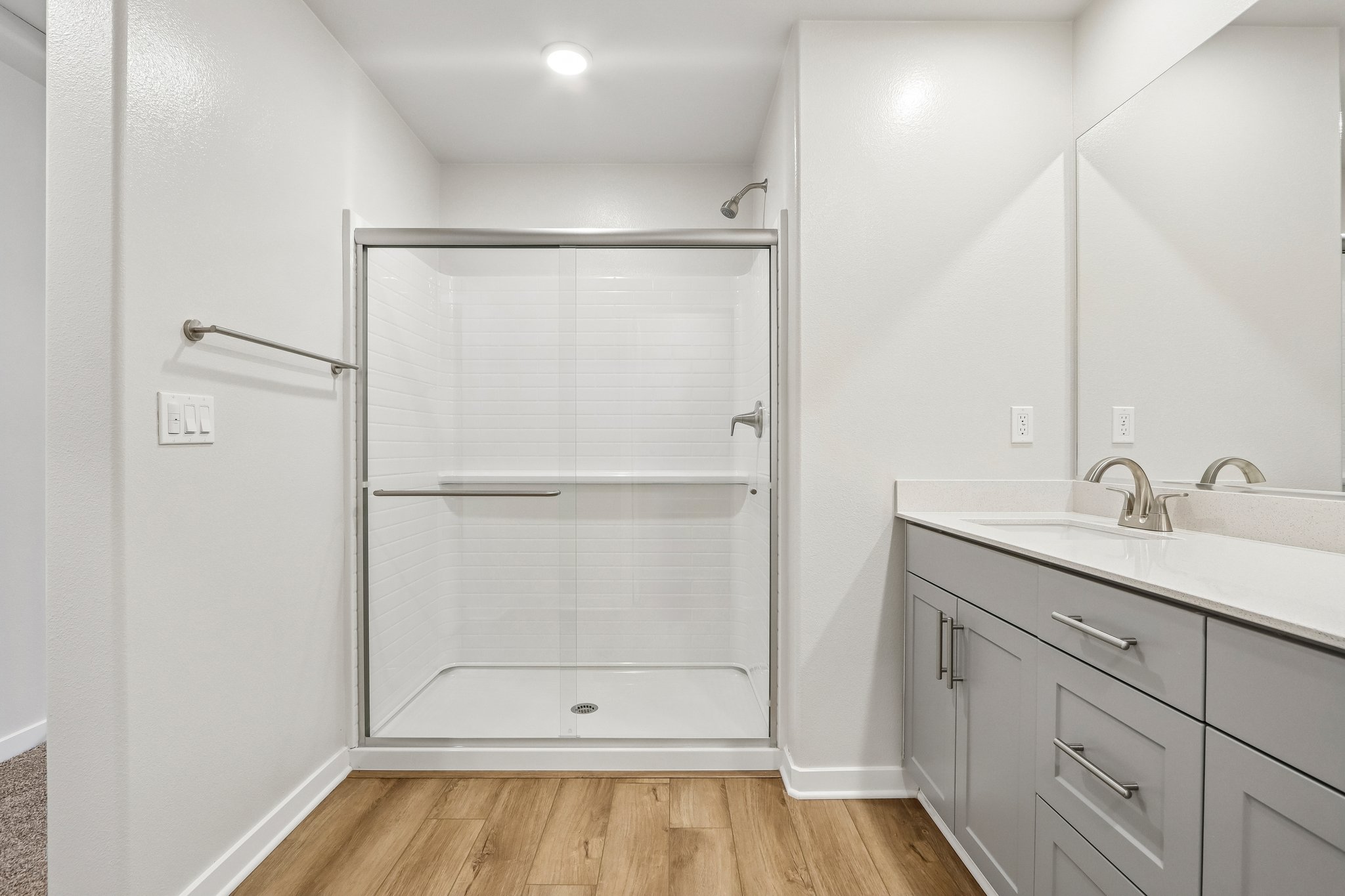 A bathroom with a shower unit.