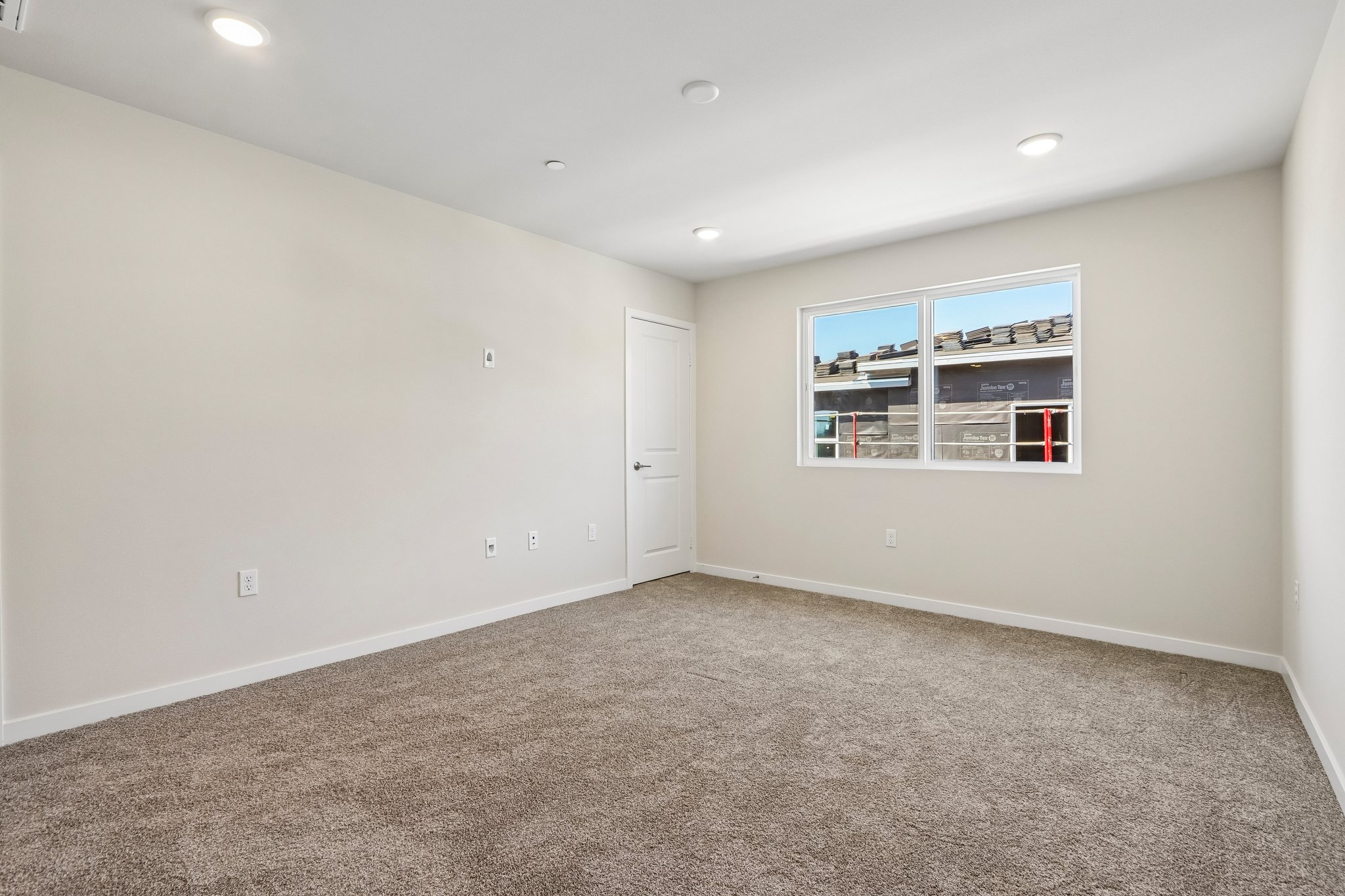 A room with a door and a window.