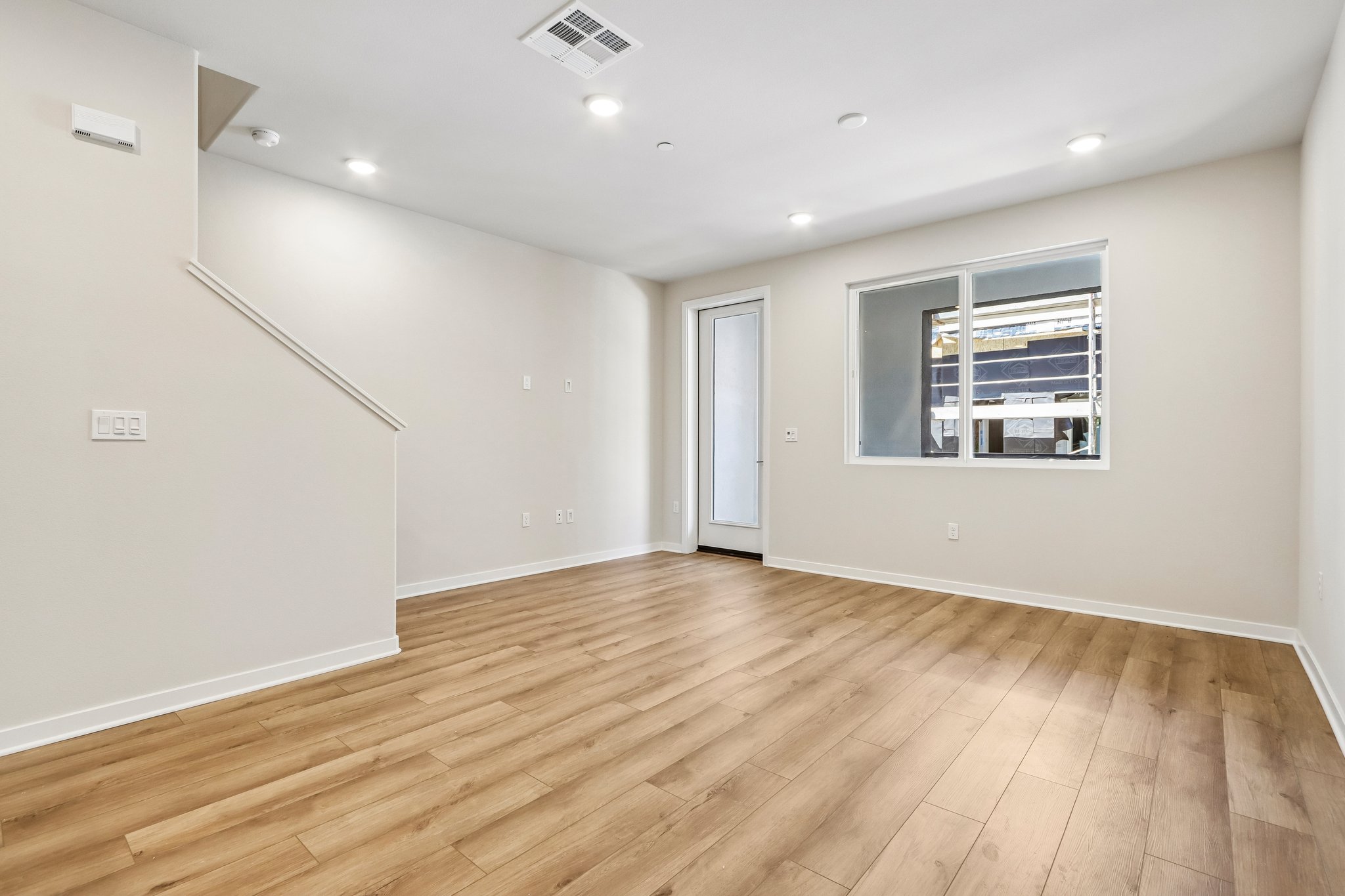 A room with a wood floor and a wood floor.