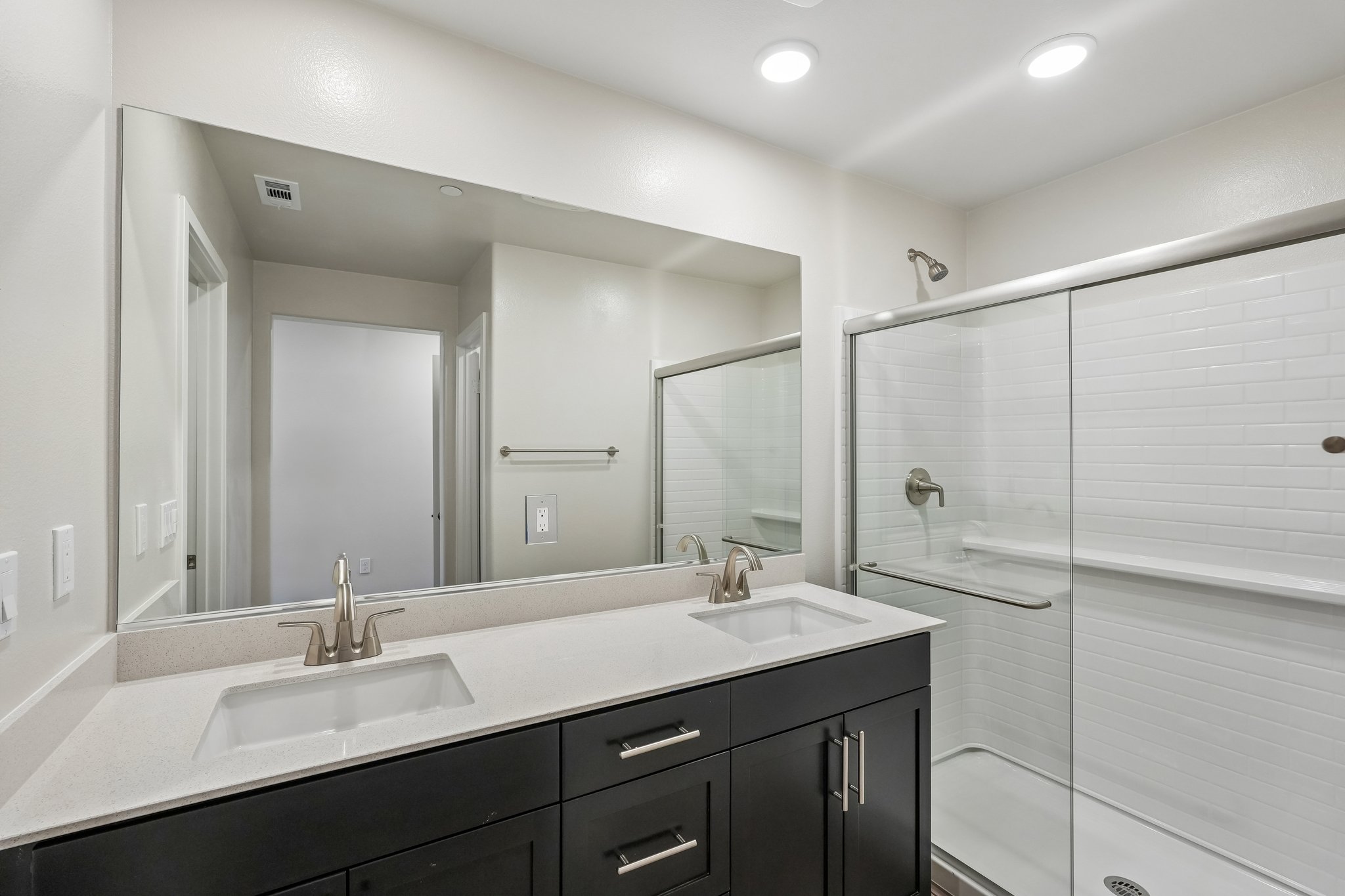 A bathroom with a glass shower.