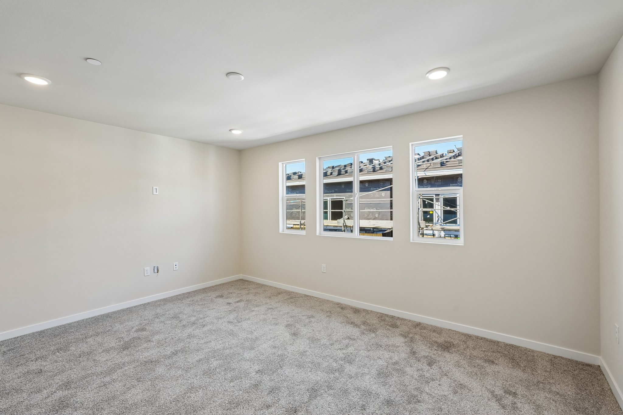 A room with a few pictures on the wall.