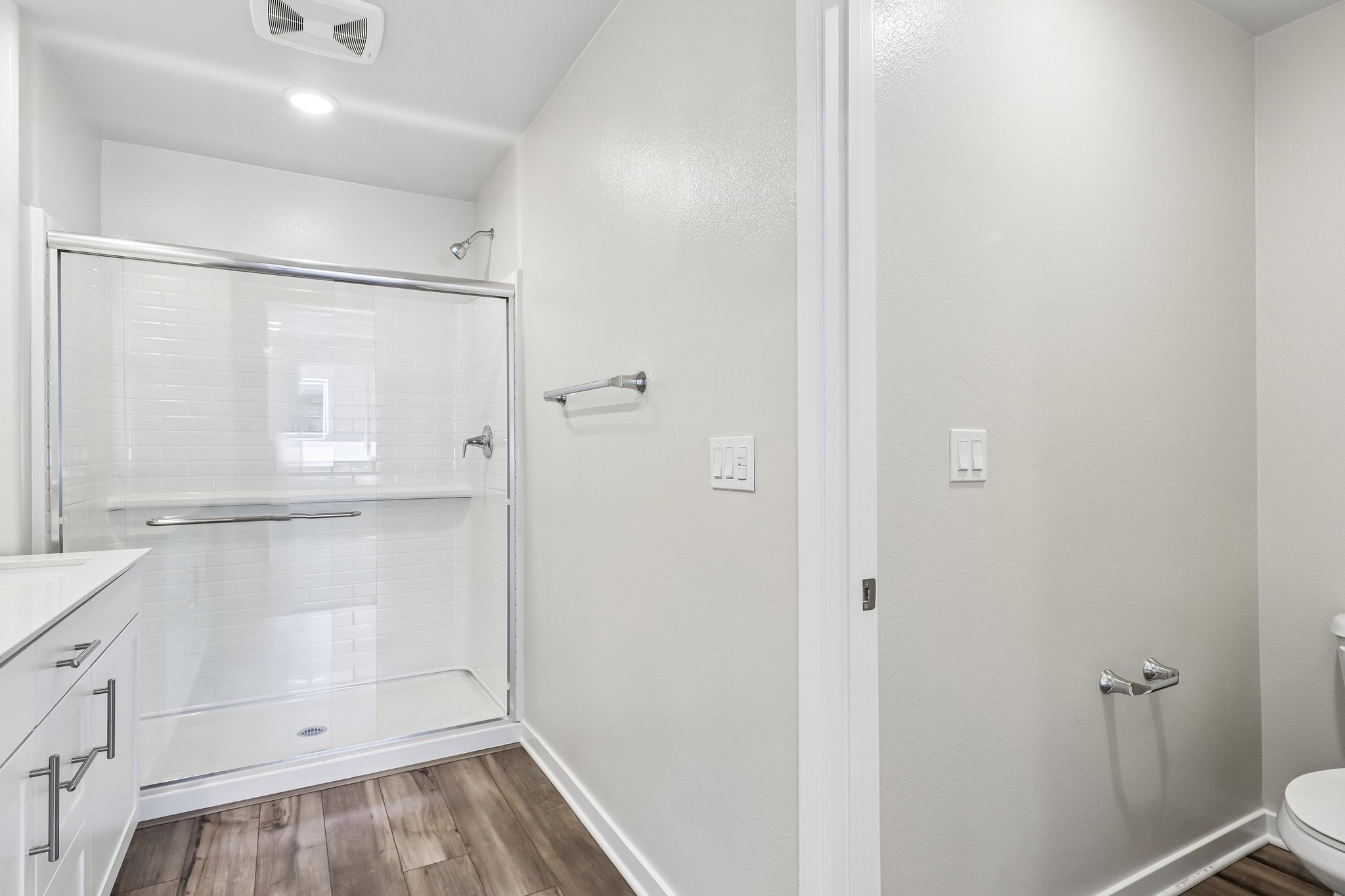 A bathroom with a glass shower.