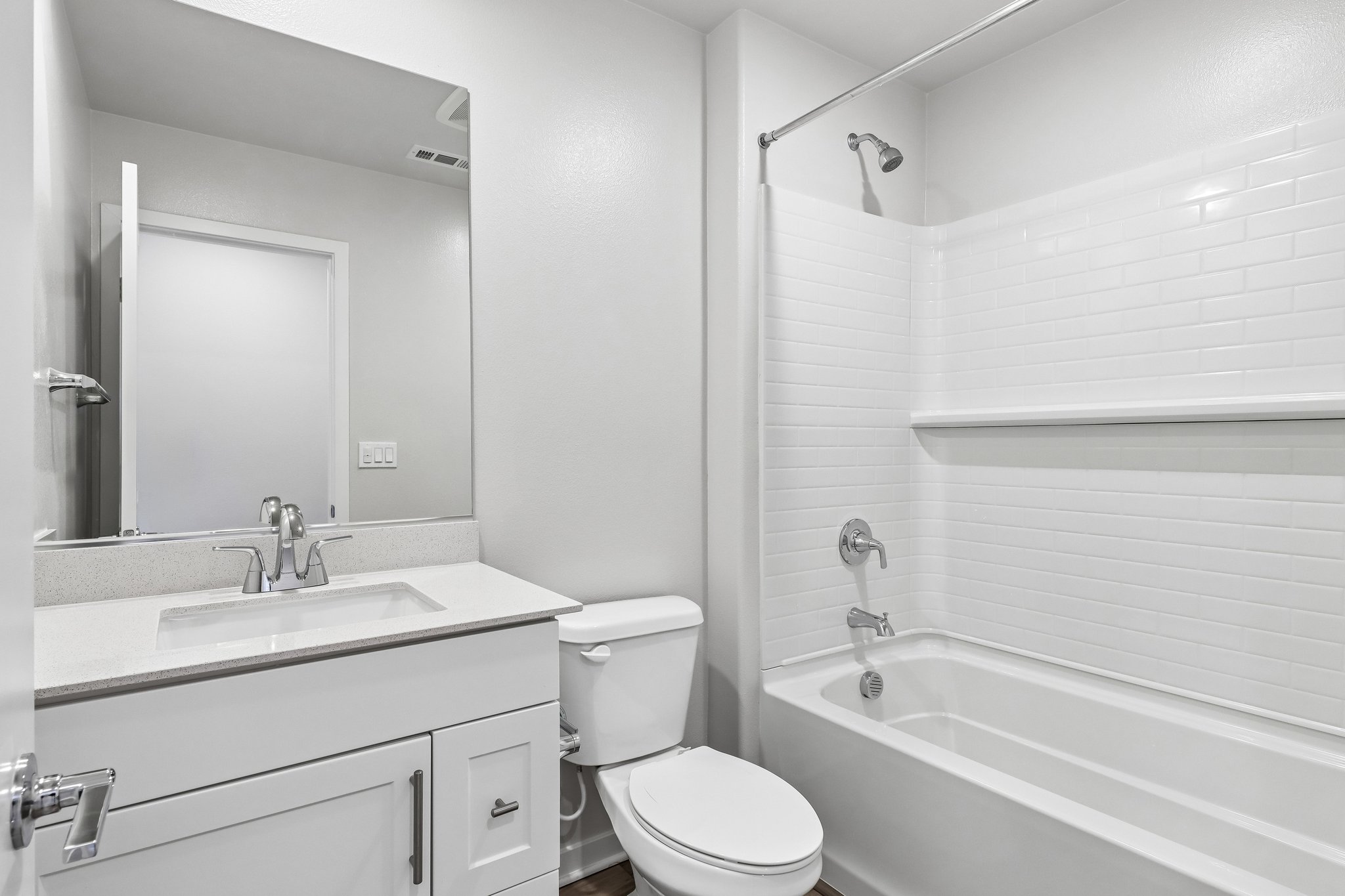 A bathroom with a toilet sink and bathtub.