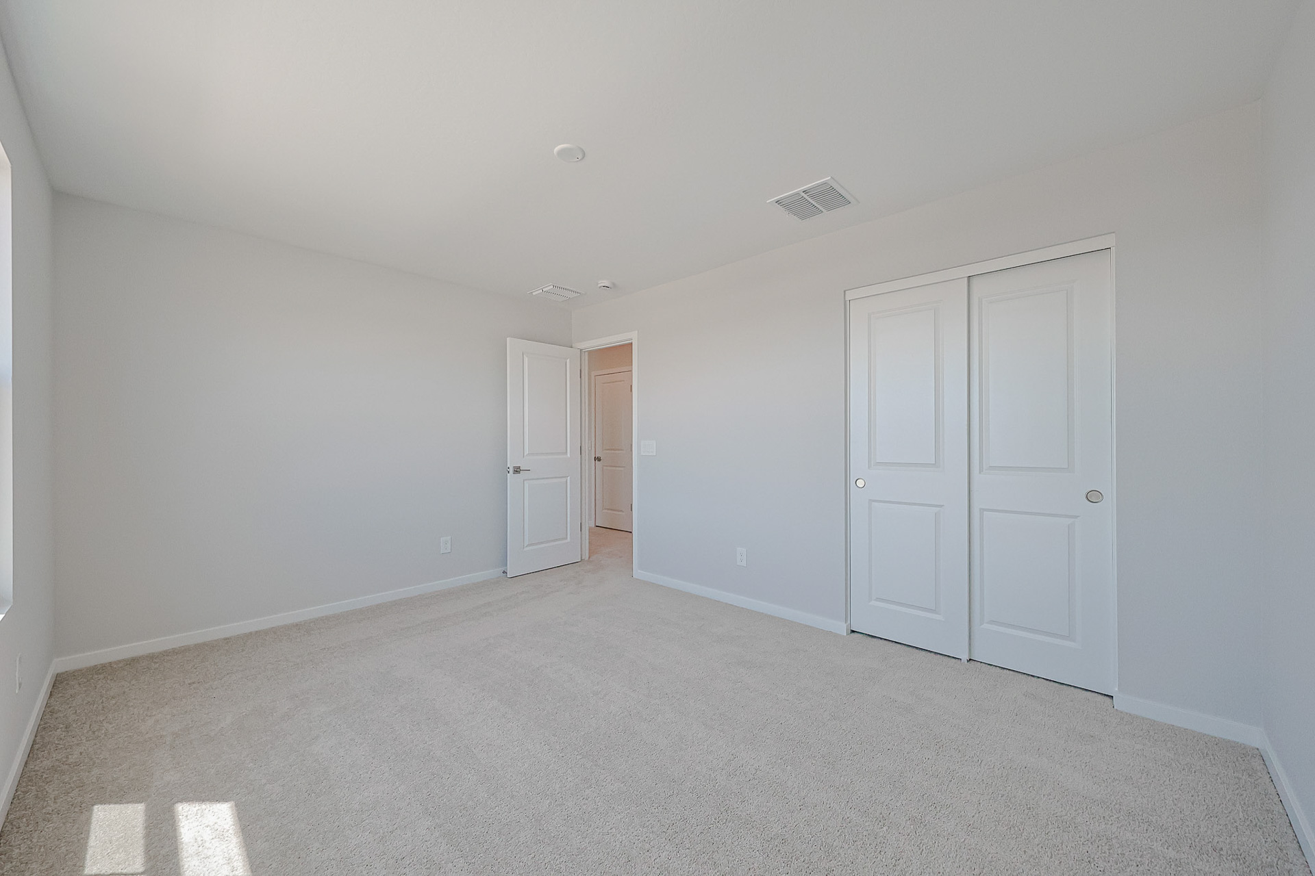 A room with white doors.