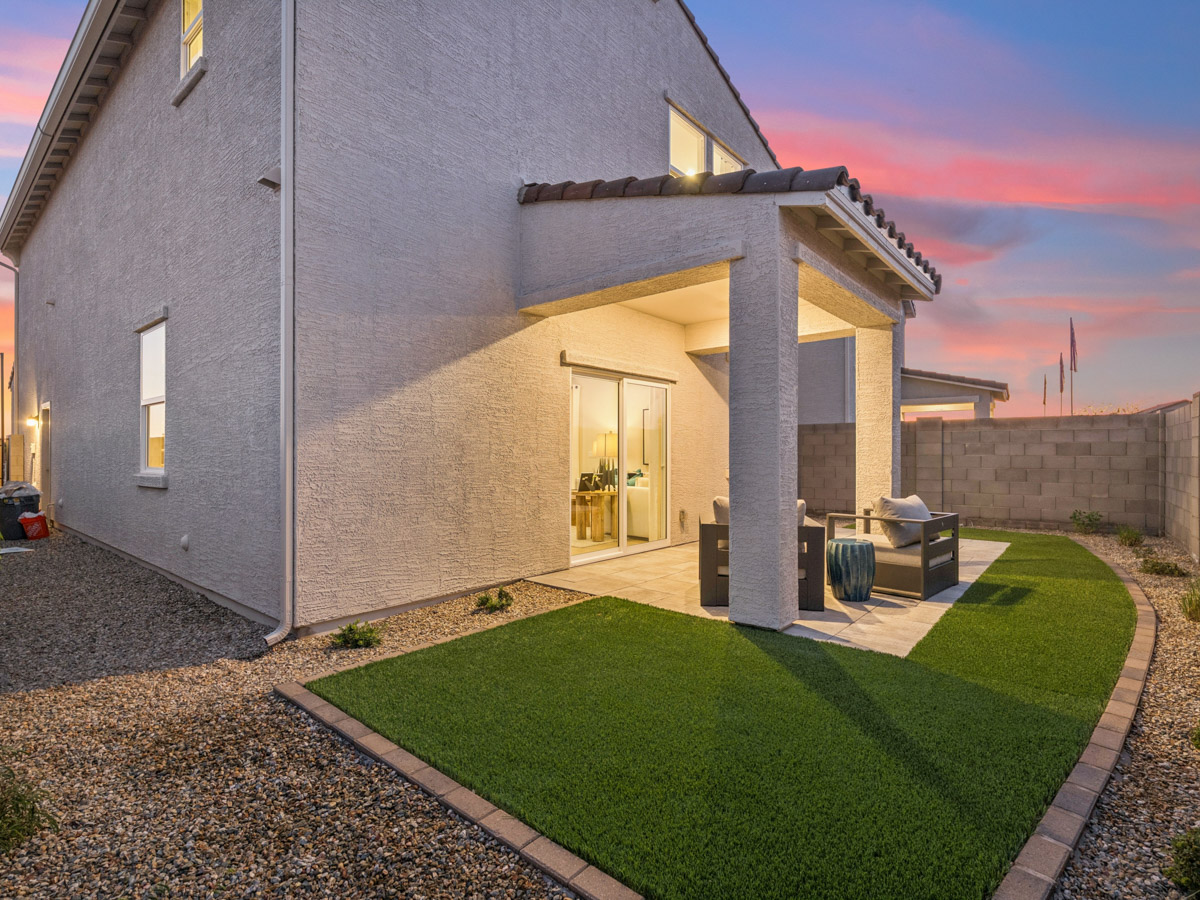 A house with a green lawn.