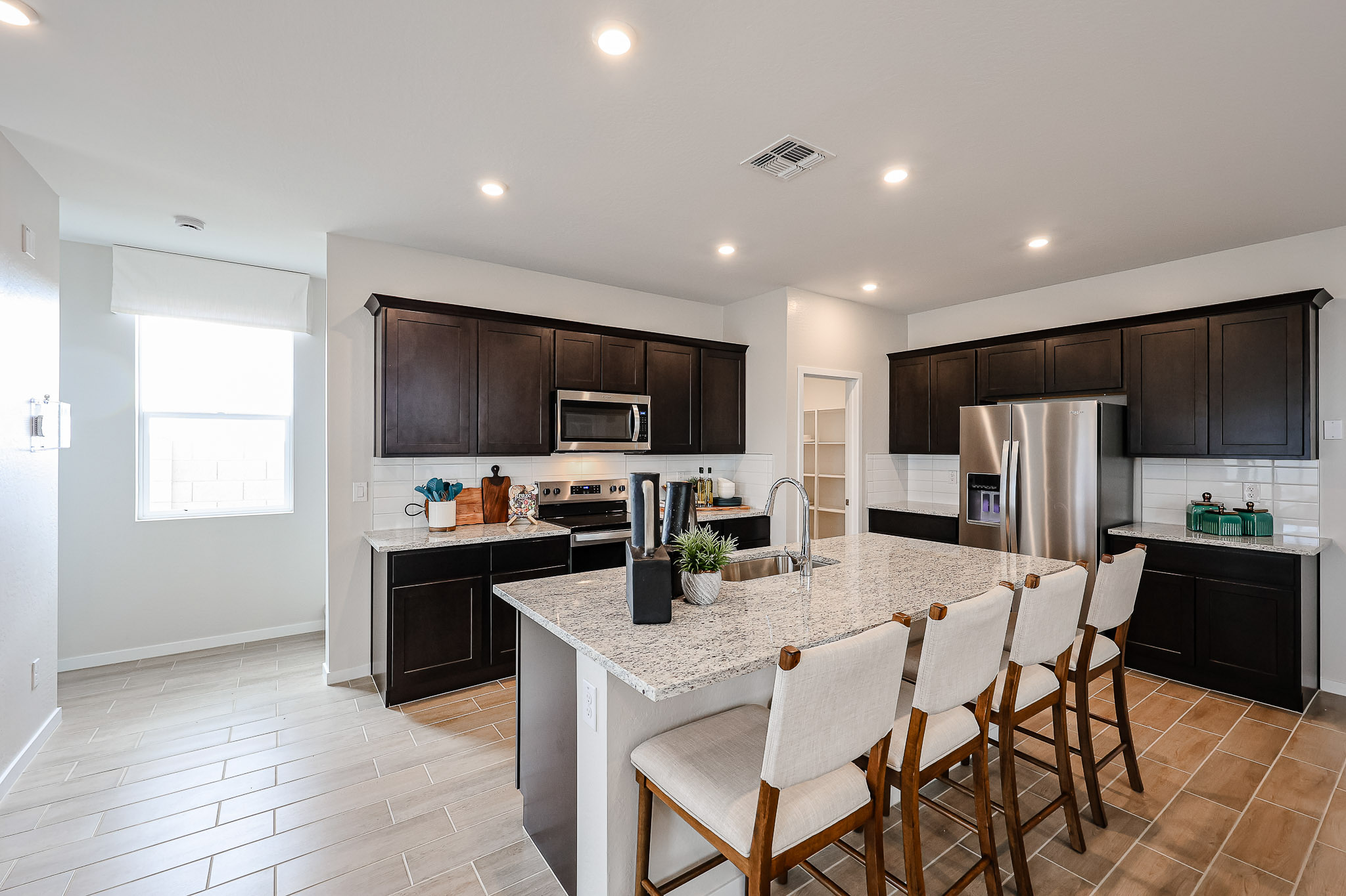 A kitchen with a dining table.