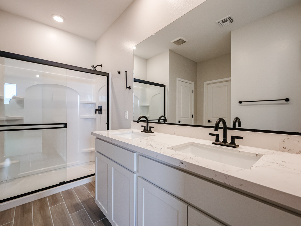 A bathroom with a glass shower.
