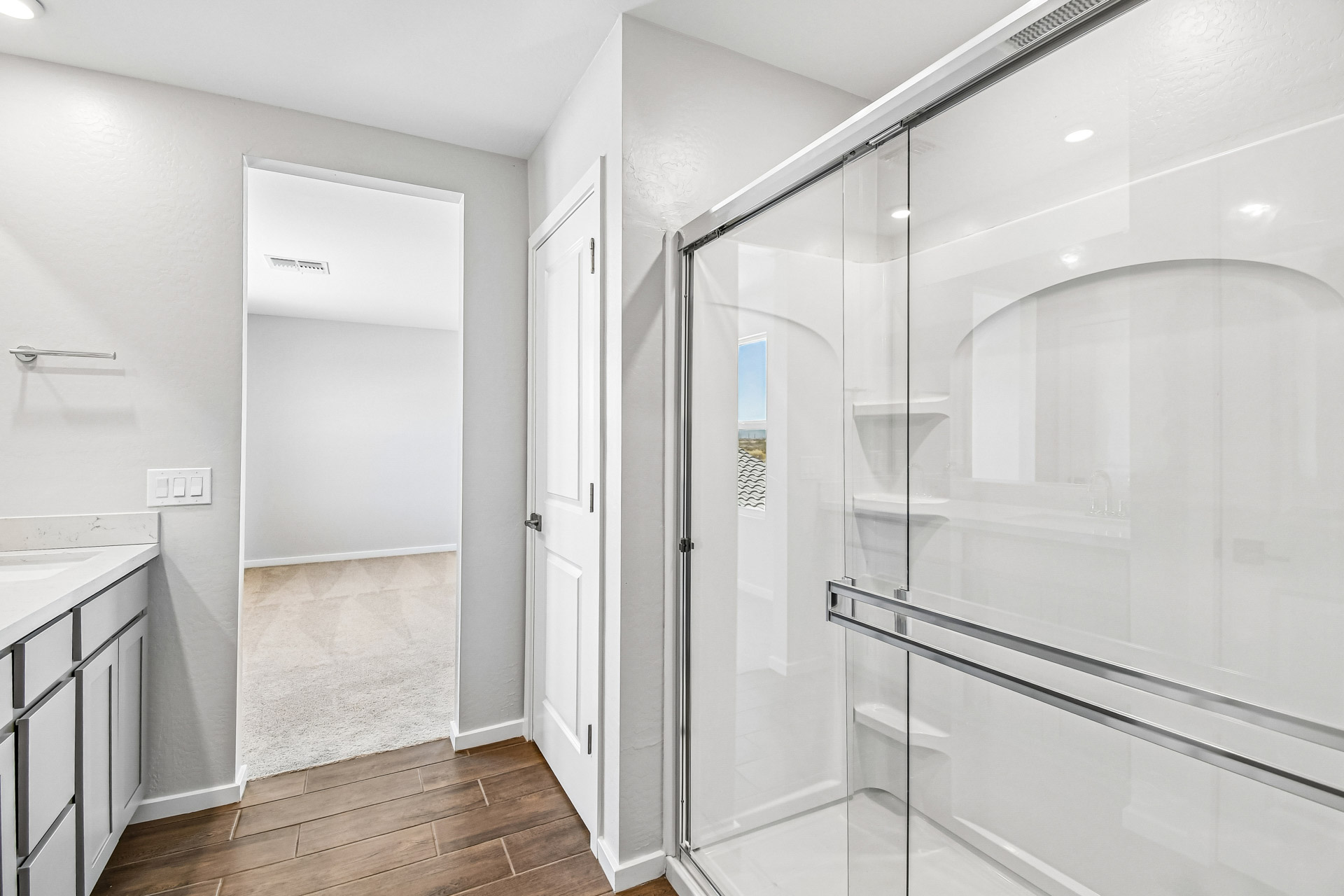 A bathroom with a glass shower.