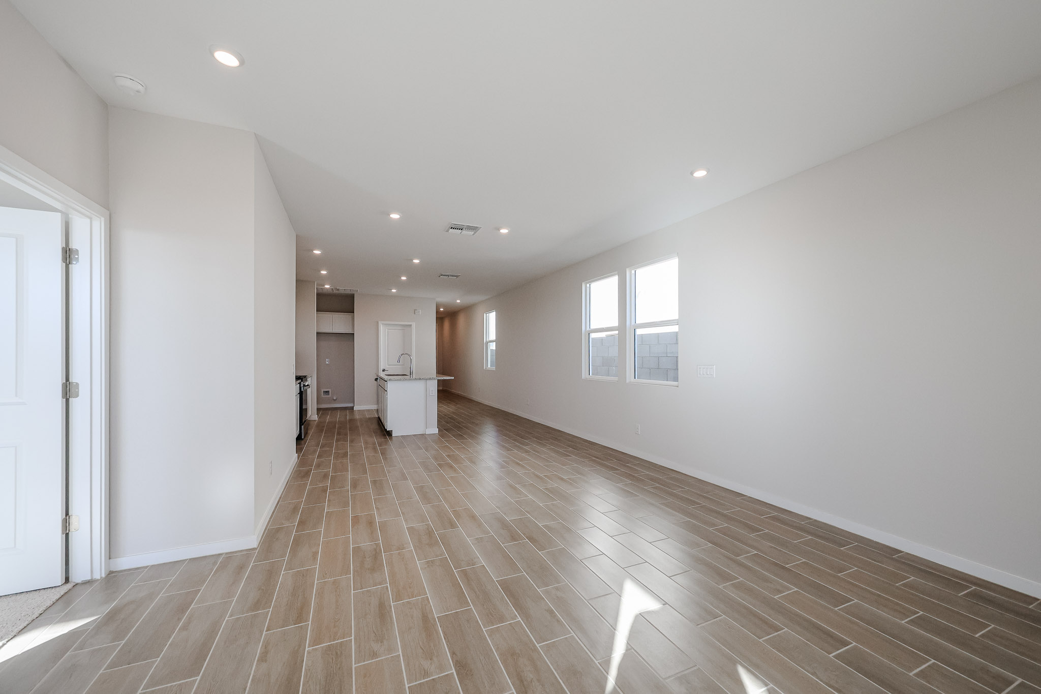 A long hallway with white walls.