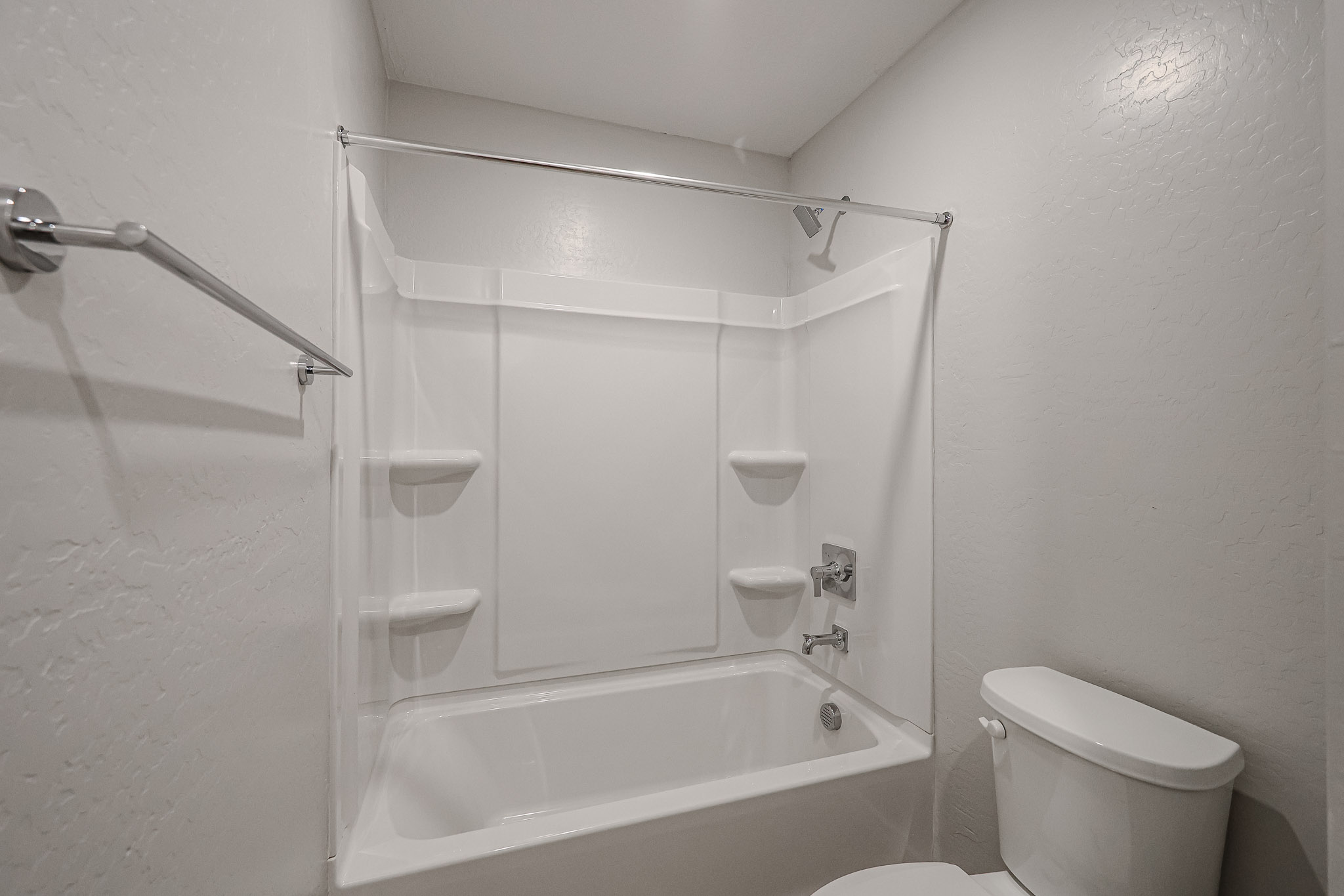 A bathroom with a stand up shower.