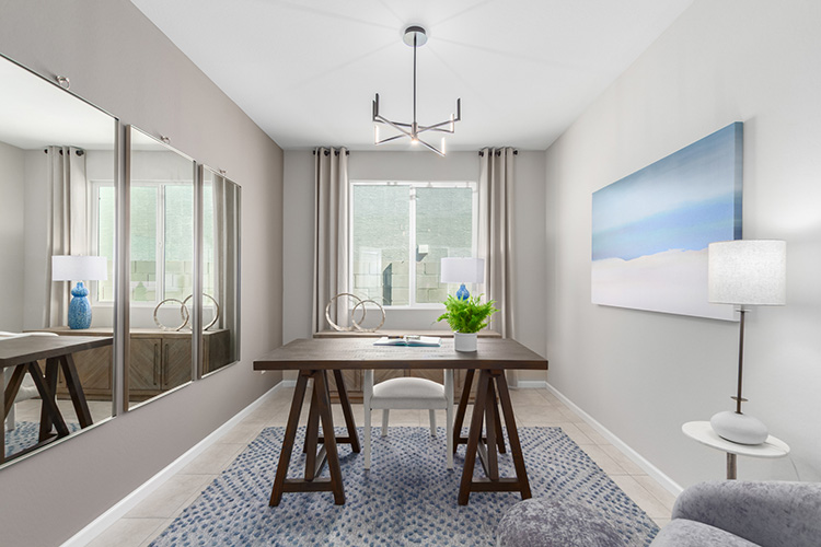 A room with a table and chairs.