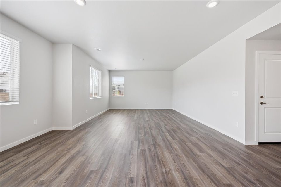 A room with wood floors.