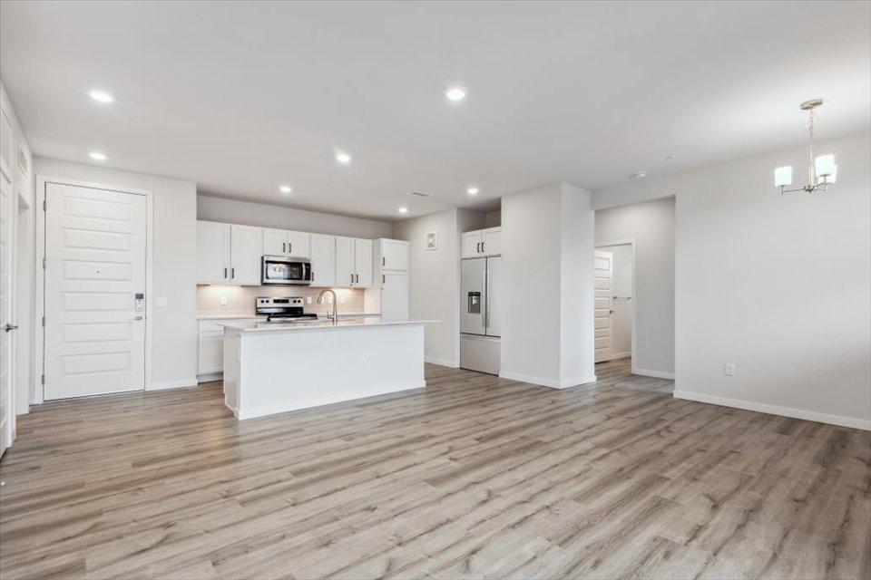 A large kitchen with white cabinets.