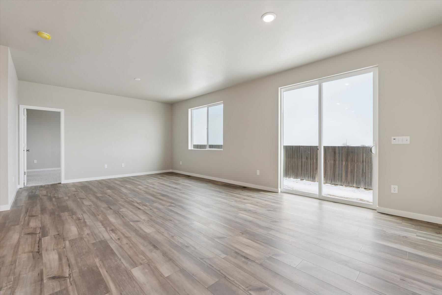A room with a wood floor and a wood floor.