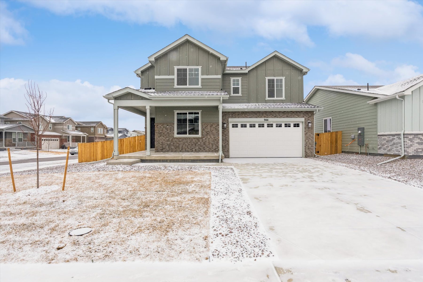 A house with a garage and a fence around it.