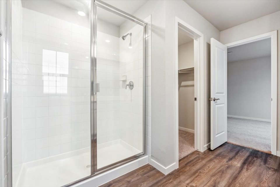 A bathroom with a glass shower.