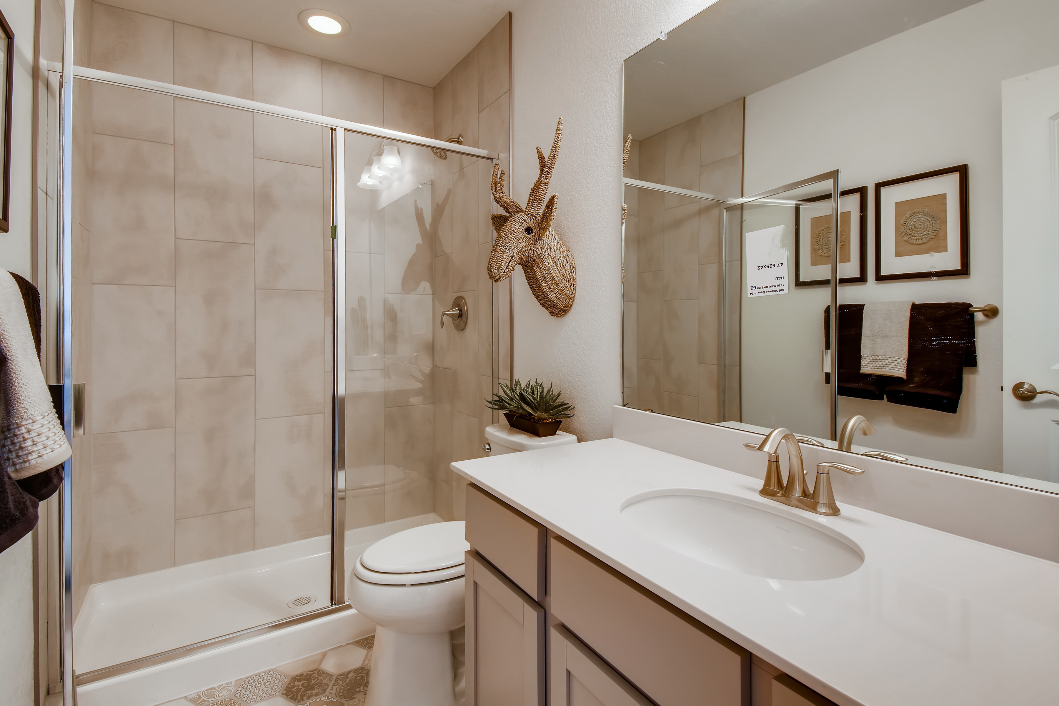 A bathroom with a glass shower.