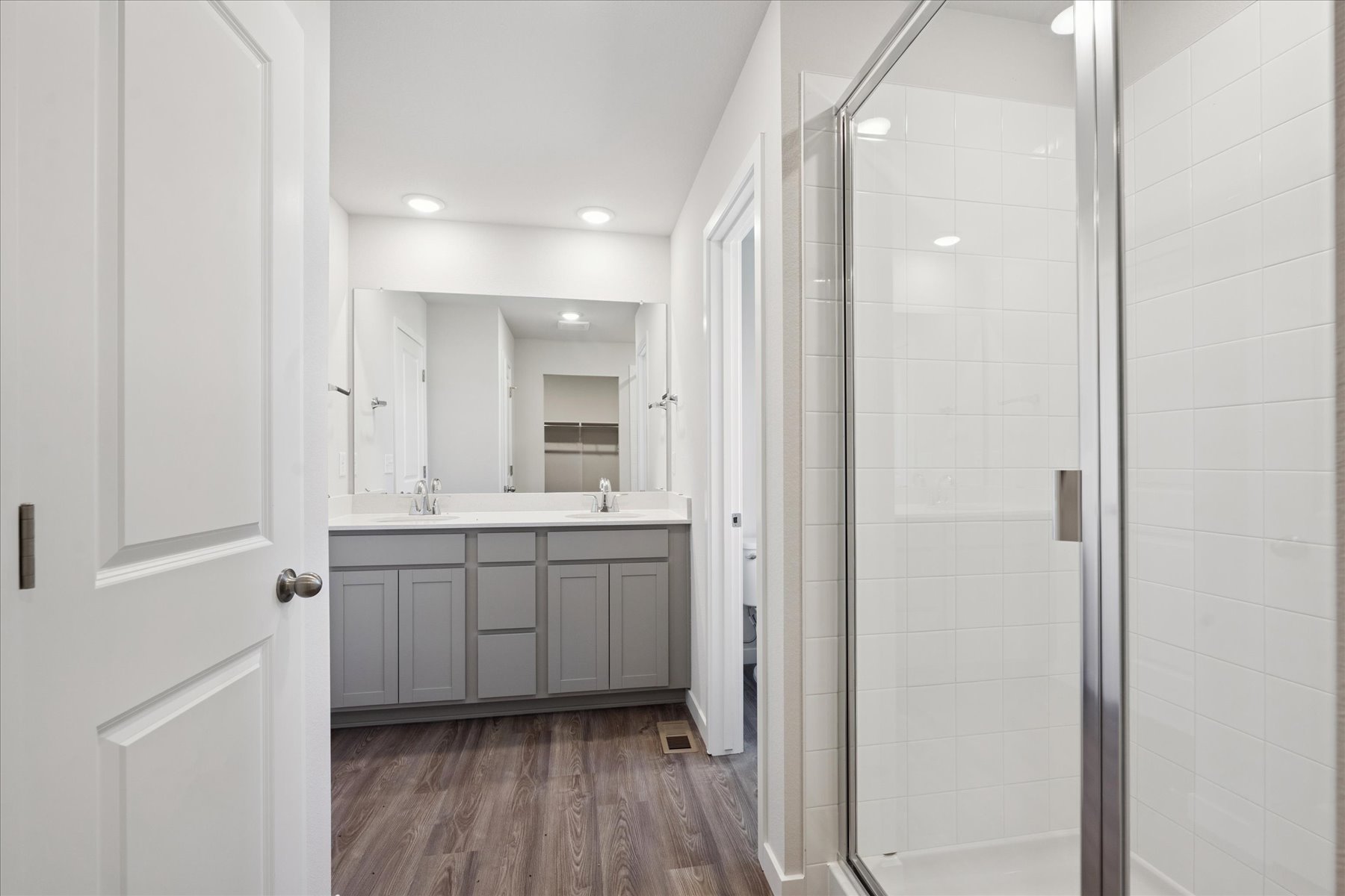 A bathroom with a glass shower.