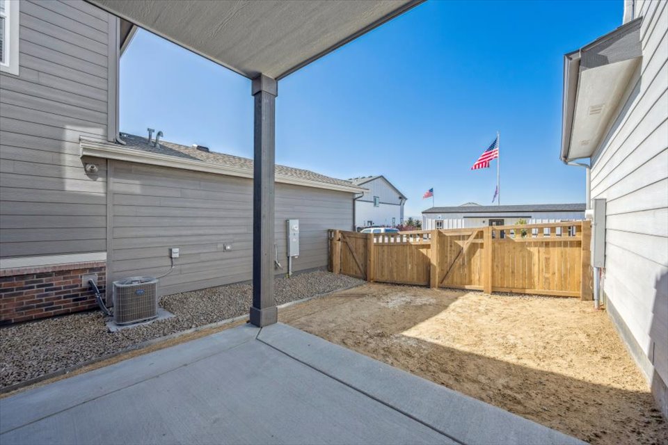 A building with a fence and a flag on the roof.