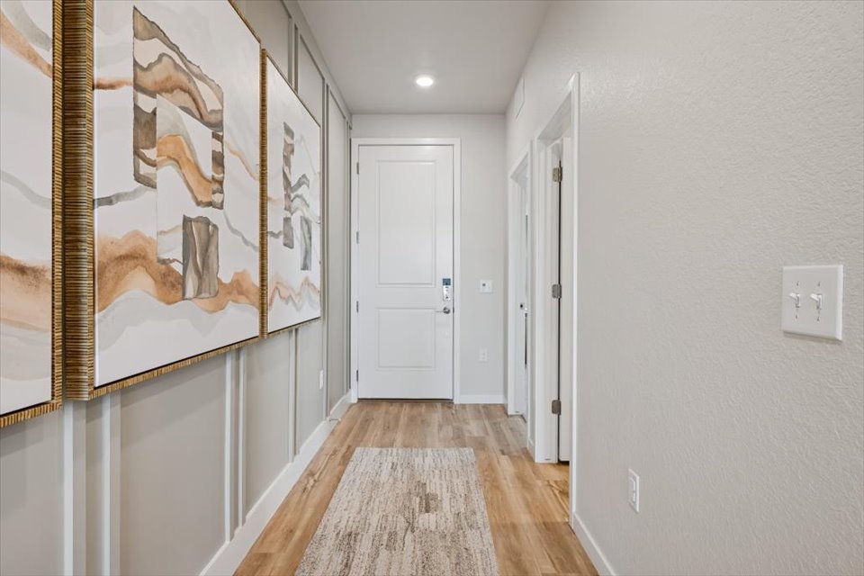 A hallway with white doors.