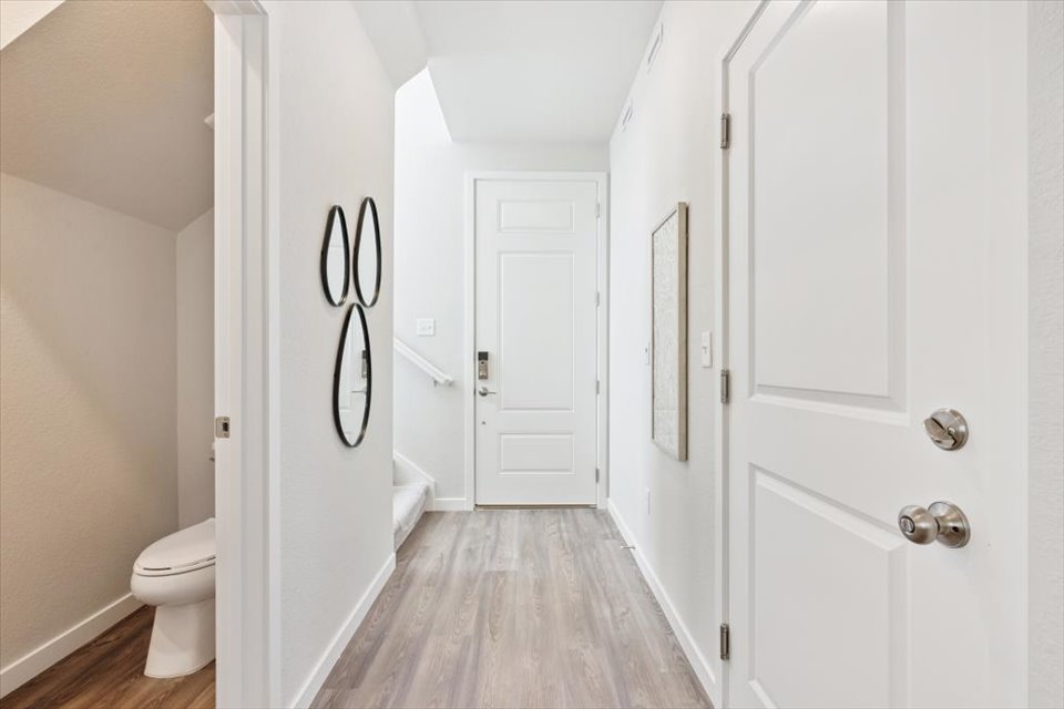 A bathroom with white doors.