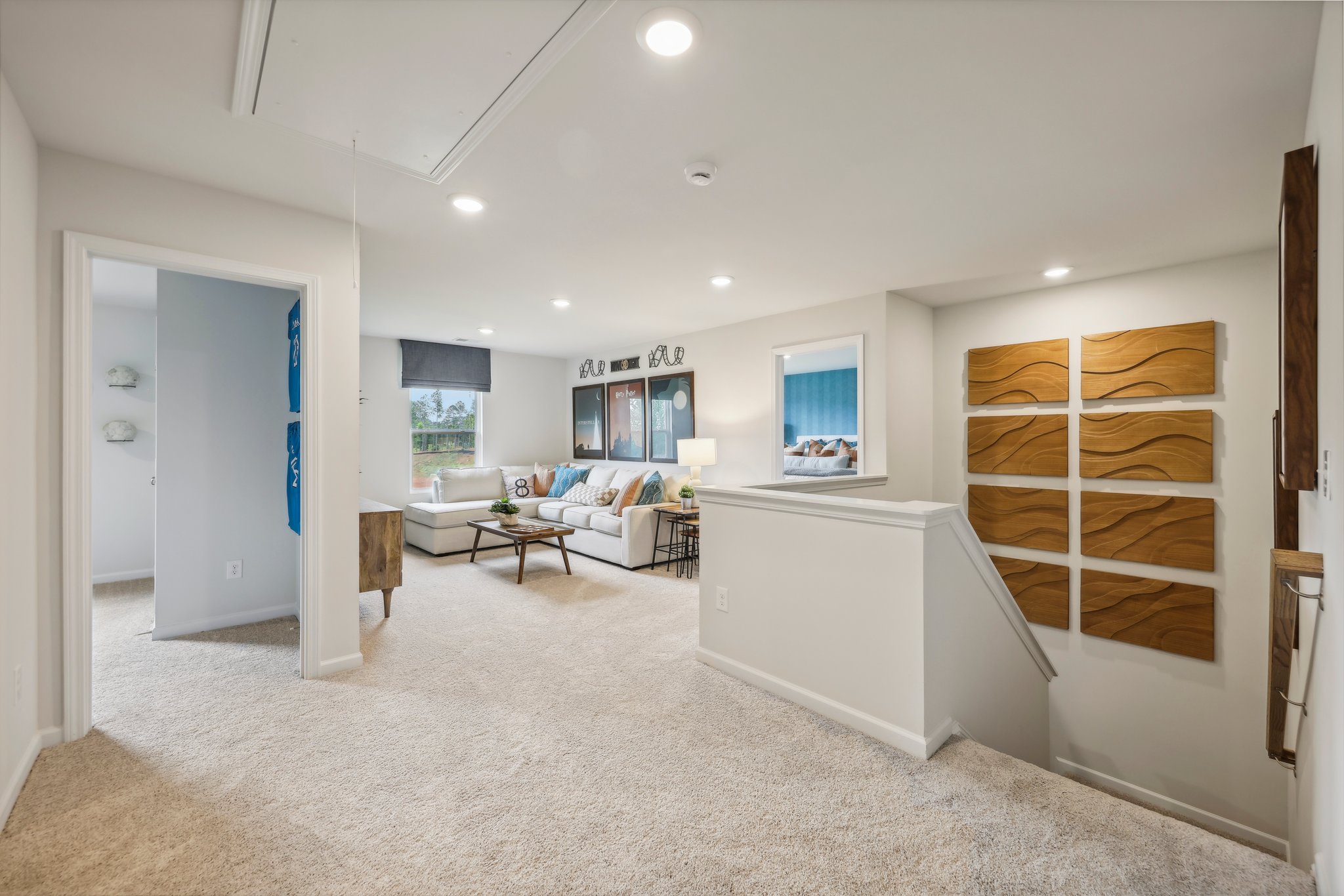 A large room with a bed and a desk.