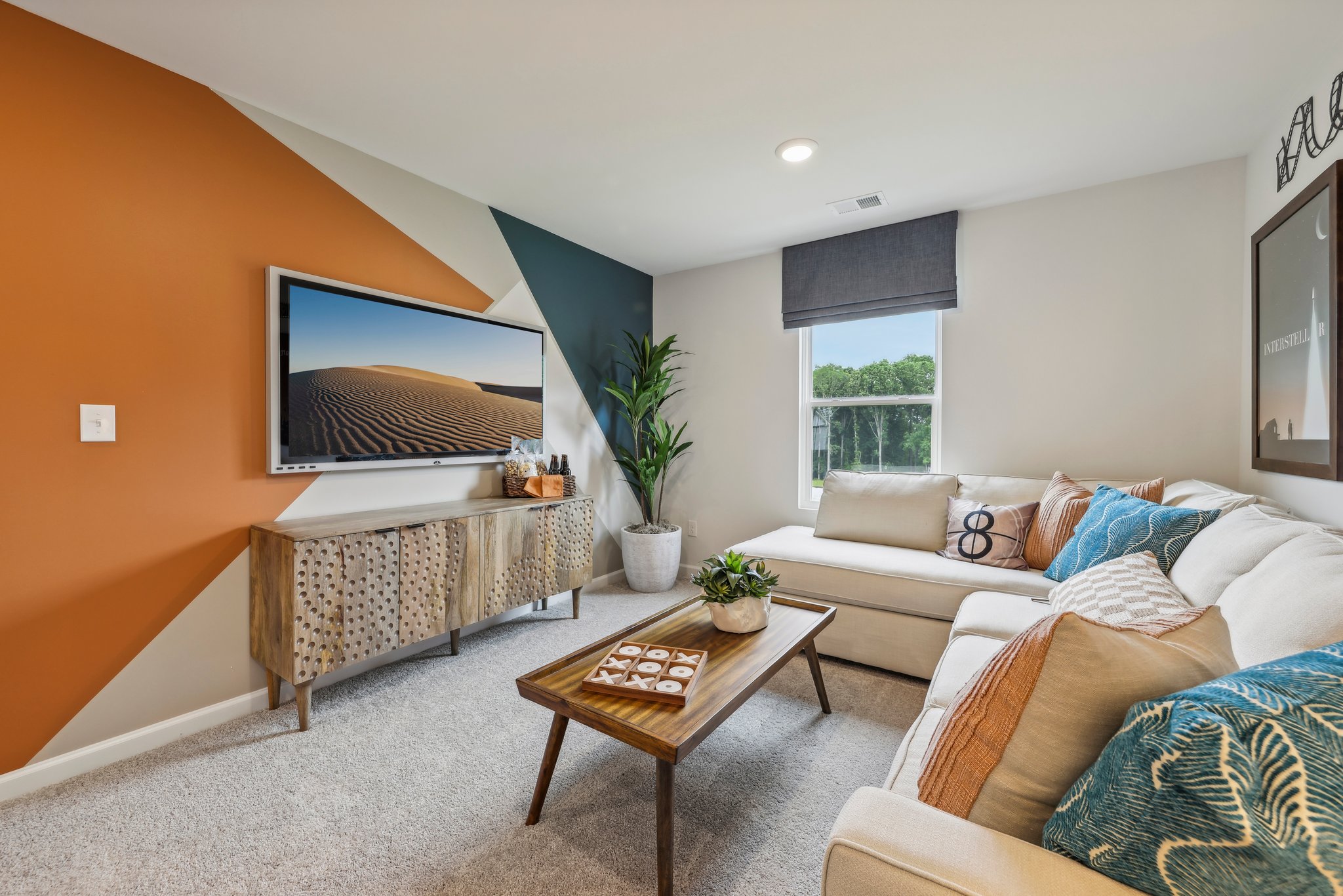 A living room with a couch and a table.