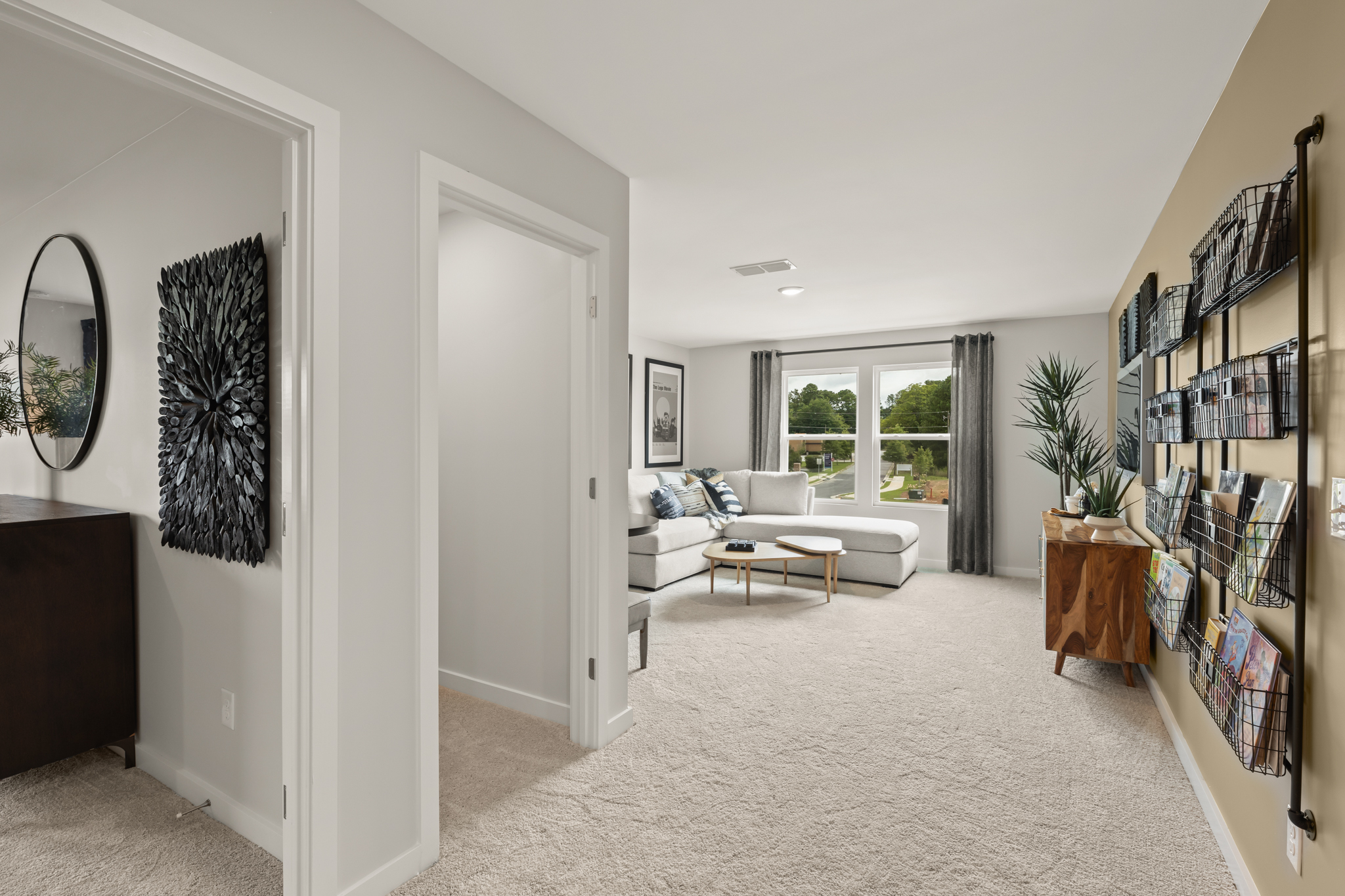 A living room with a large mirror.