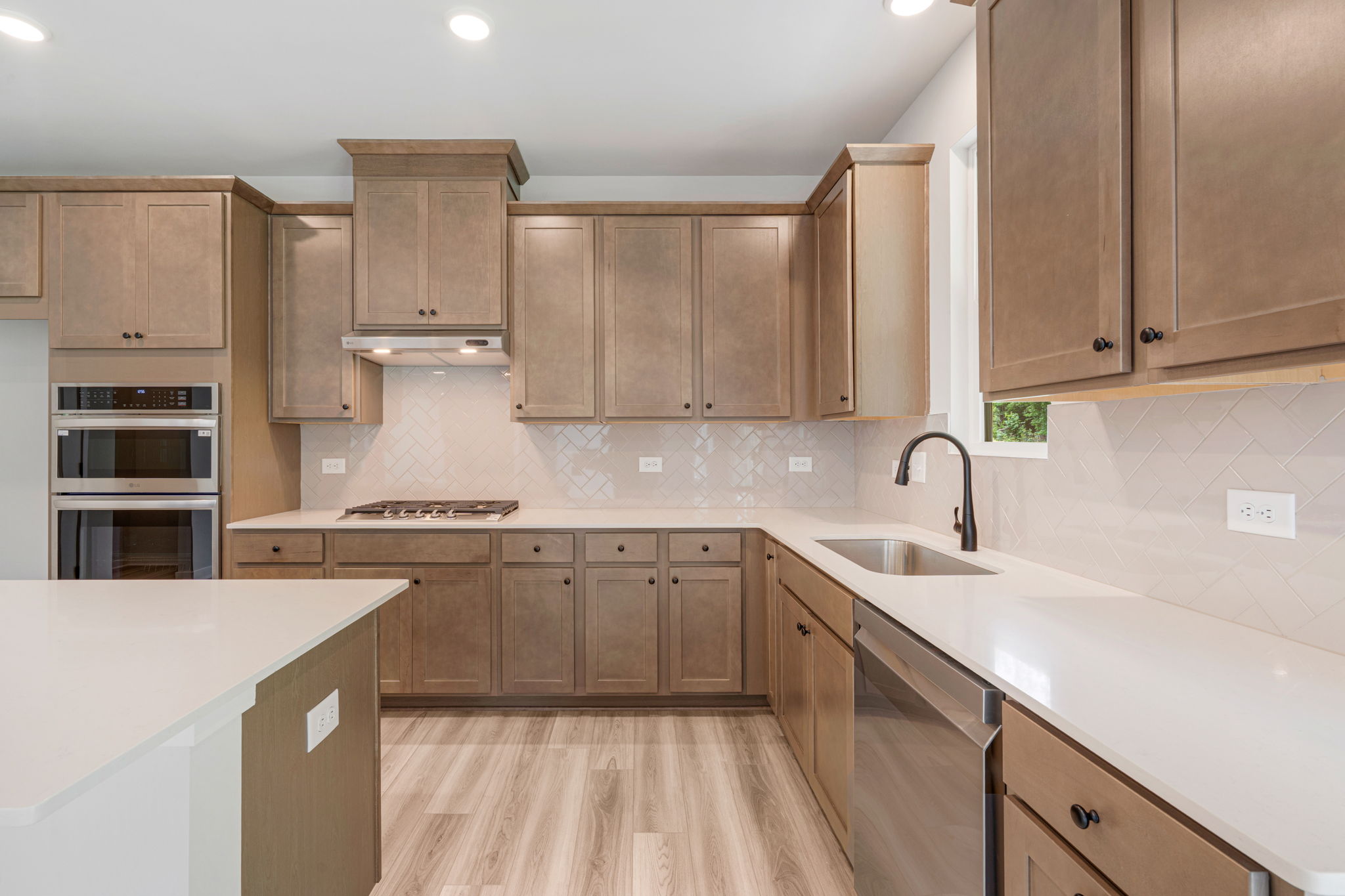 A kitchen with wooden cabinets.