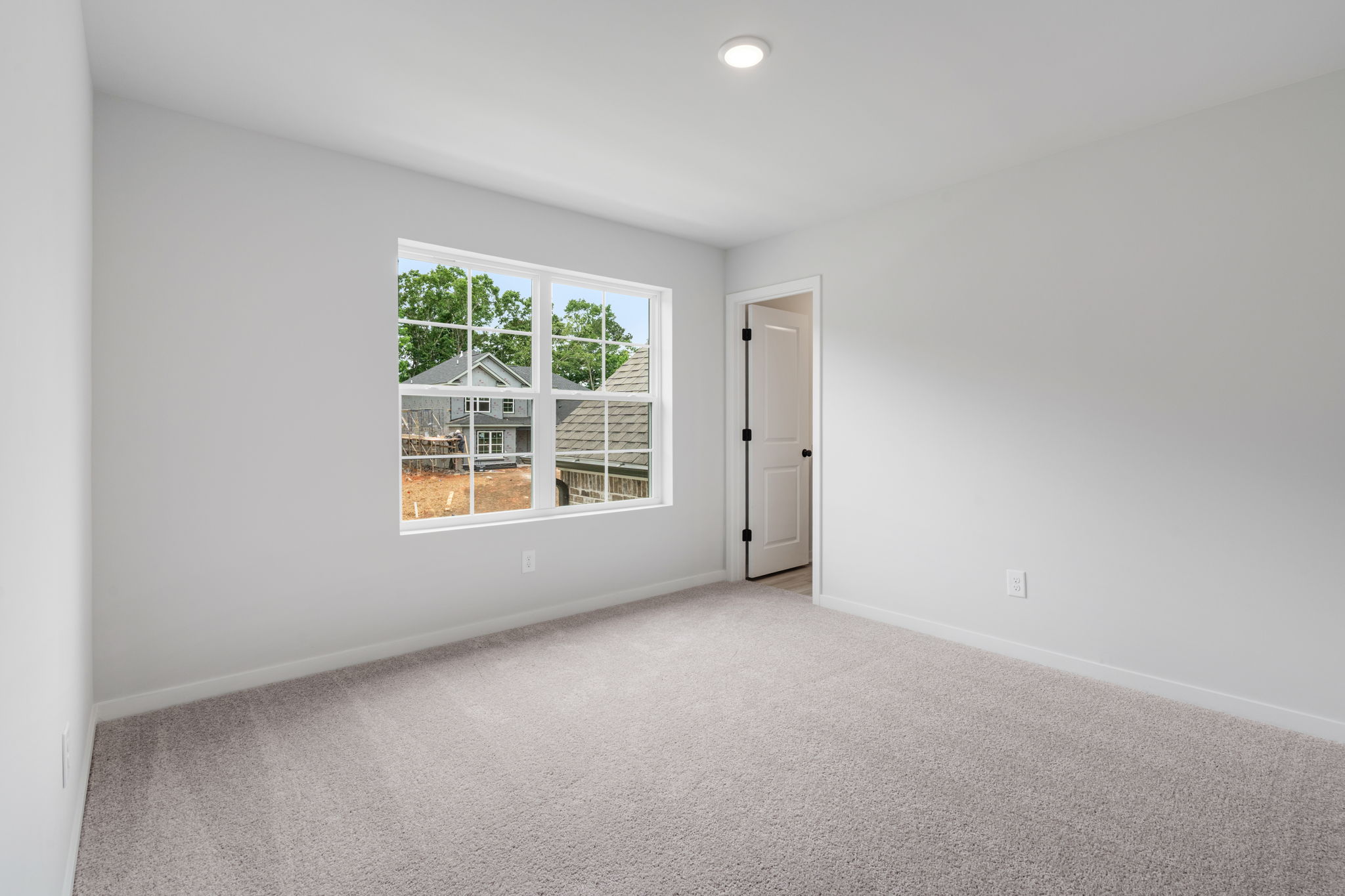 A room with a door and a window.